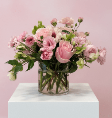 Pretty in Pinks - Soft pink roses and pale blush blooms float above a clear glass vase in this romantic flower arrangement-perfect as a birthday bouquet, anniversary gift, or a thoughtful "thinking of you" surprise.   