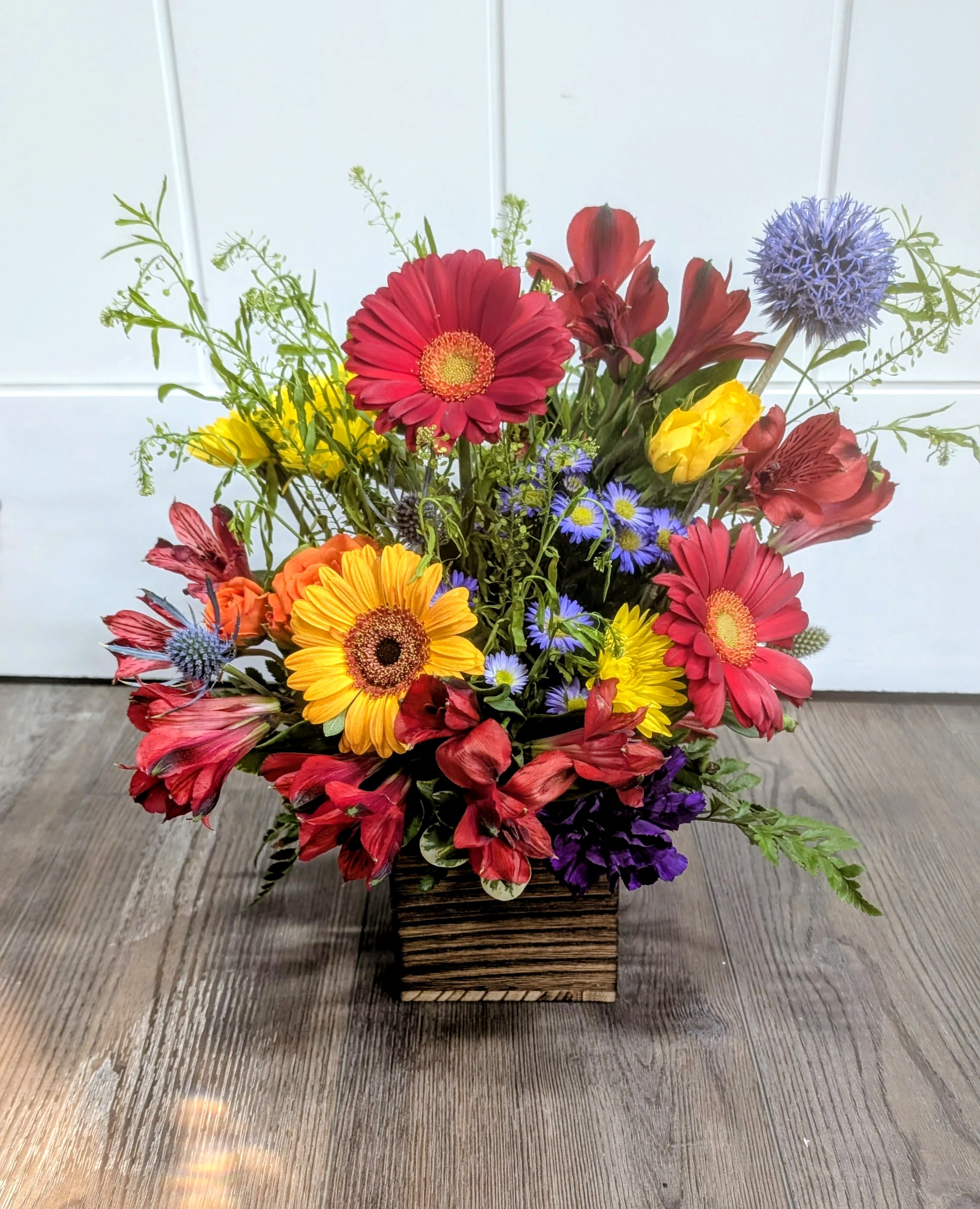 Fall Harvest - Wood container includes Gerber Daisies, Alstroemeria, thistle, mums, and a variety of greens