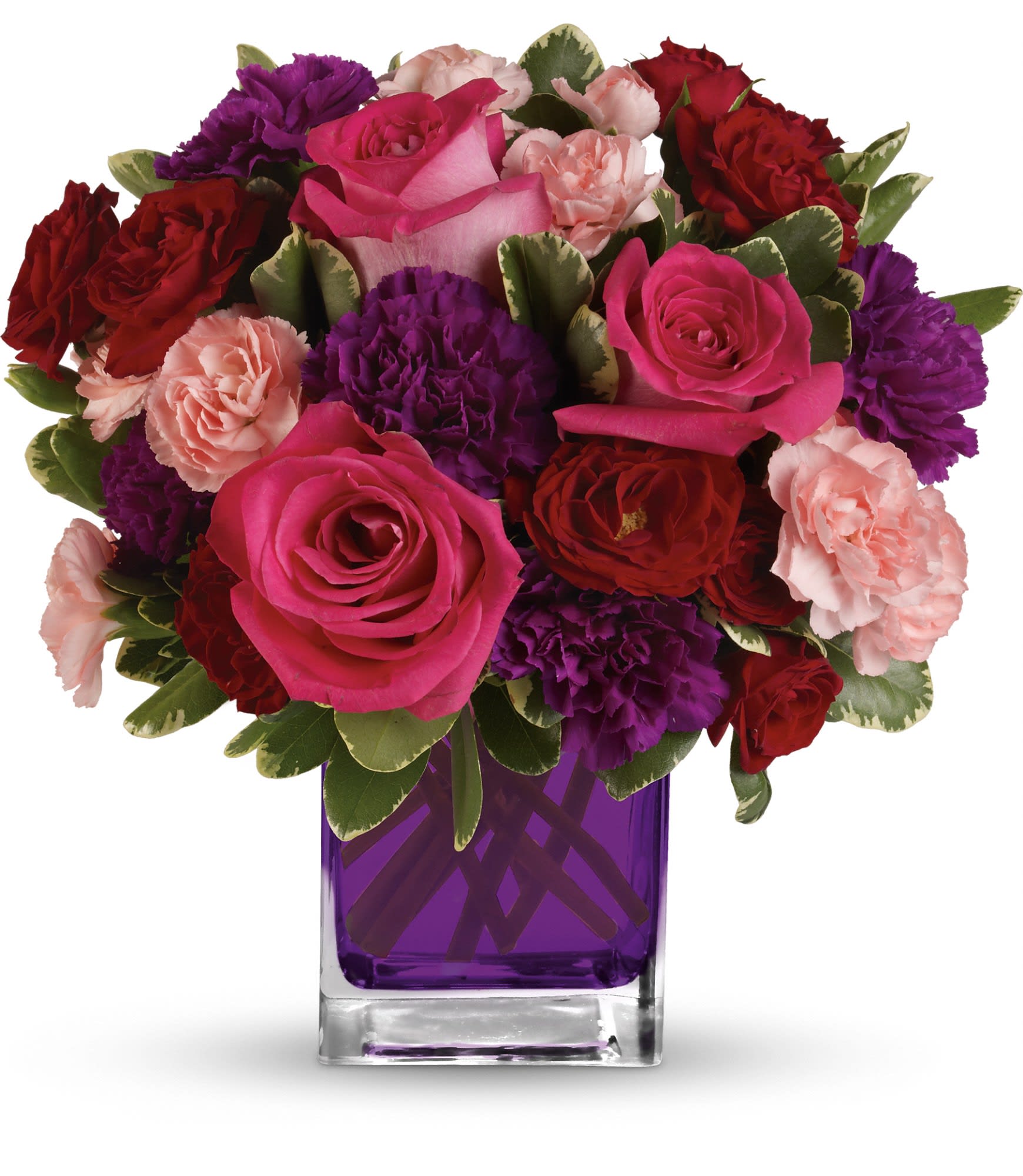 Bouquet of pink, red, and purple flowers in a purple glass vase