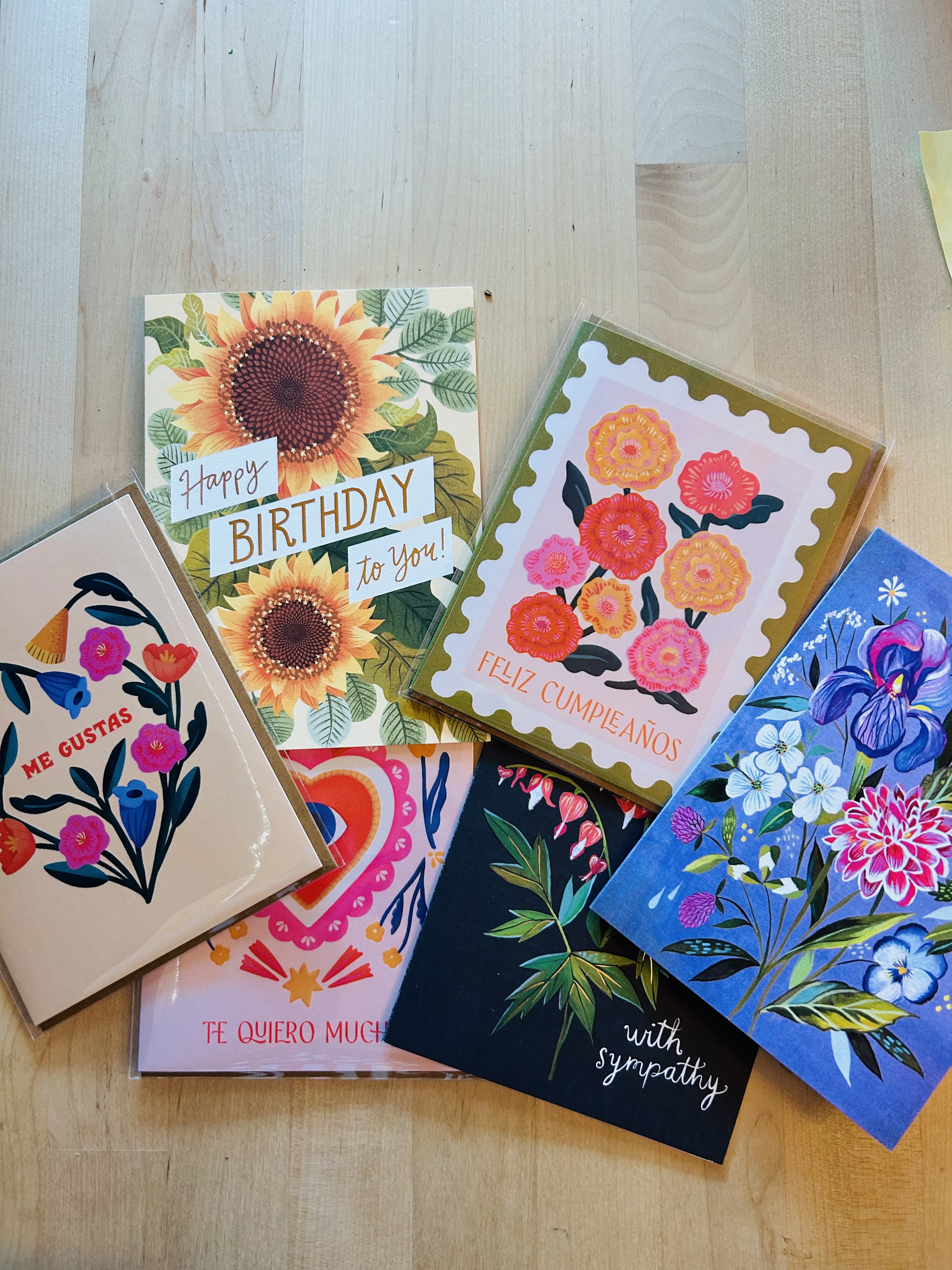 Assorted floral greeting cards with birthday and sympathy messages