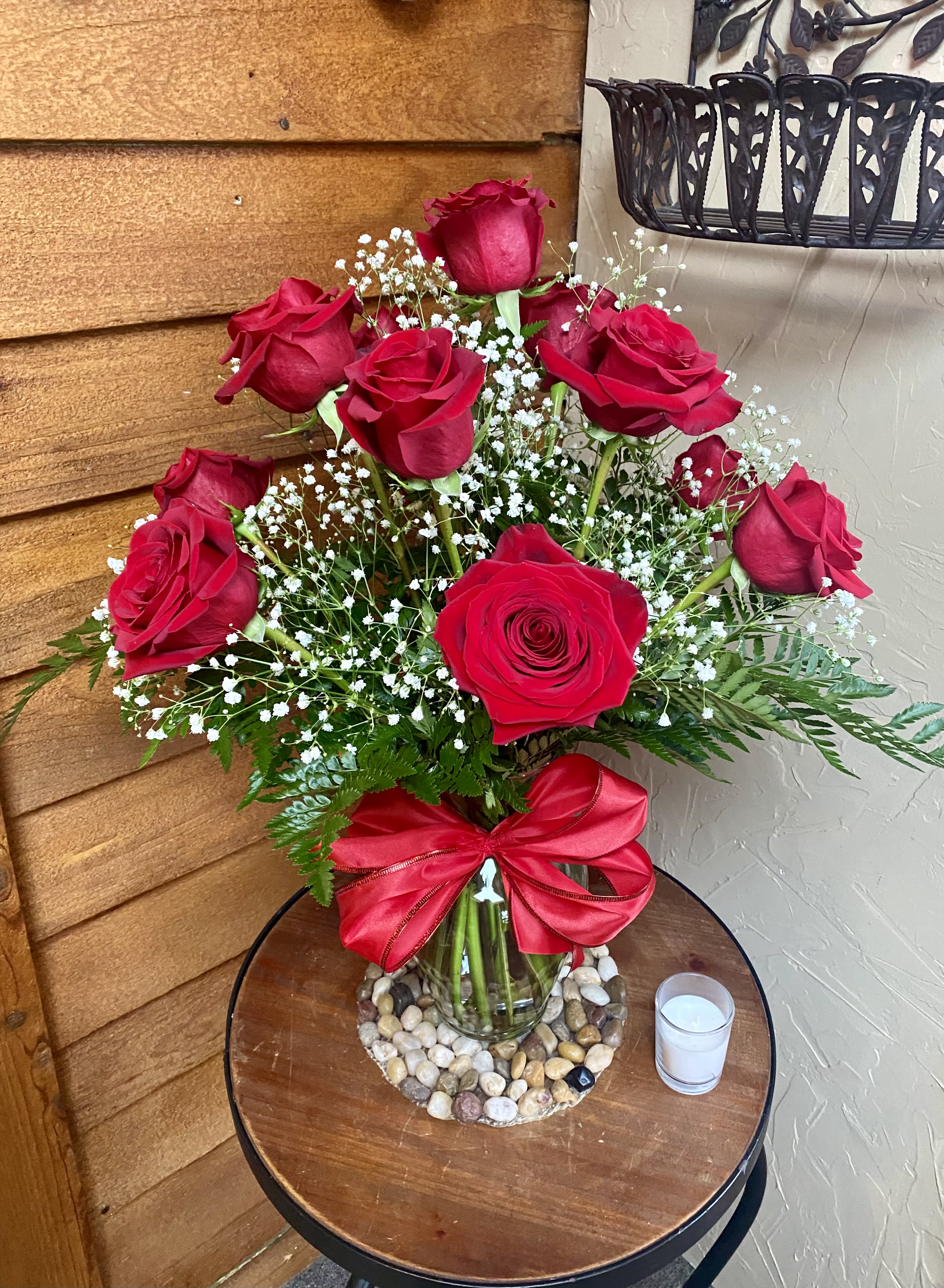 The Classic 12 Red Roses with Baby's Breath - Simple yet sophisticated for a simply beautiful loving gift.  This is the classic red rose, baby's breath &amp; greenery with a big red bow!