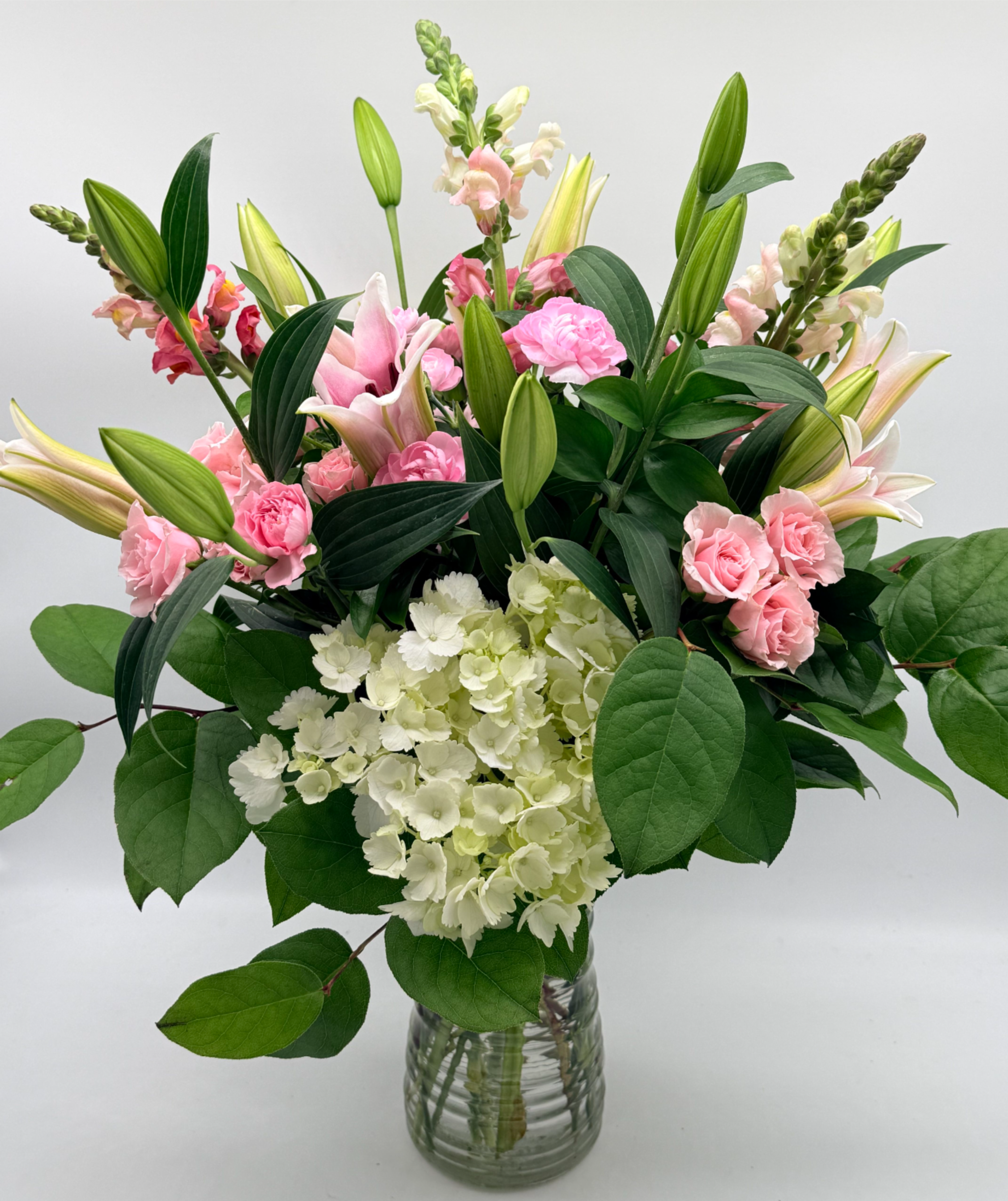 Angel Petals  - Light, airy, and elegant, this arrangement features soft pink blooms paired with white for a clean, delicate look.