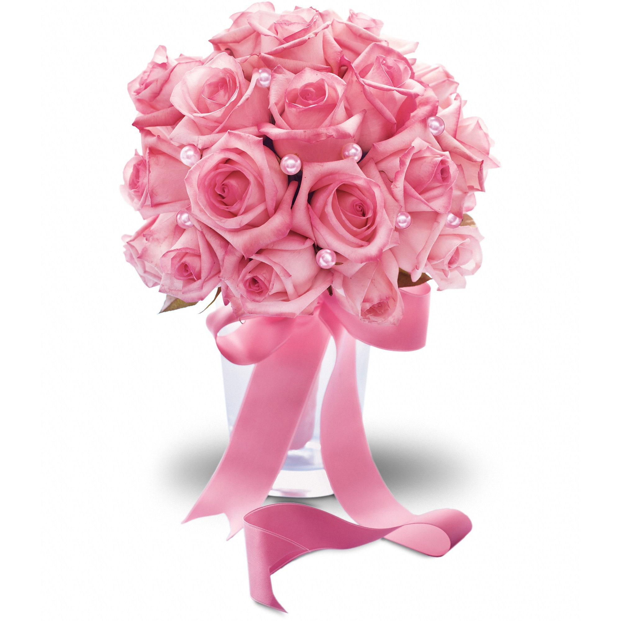 Pink rose bouquet in a clear vase with a satin ribbon