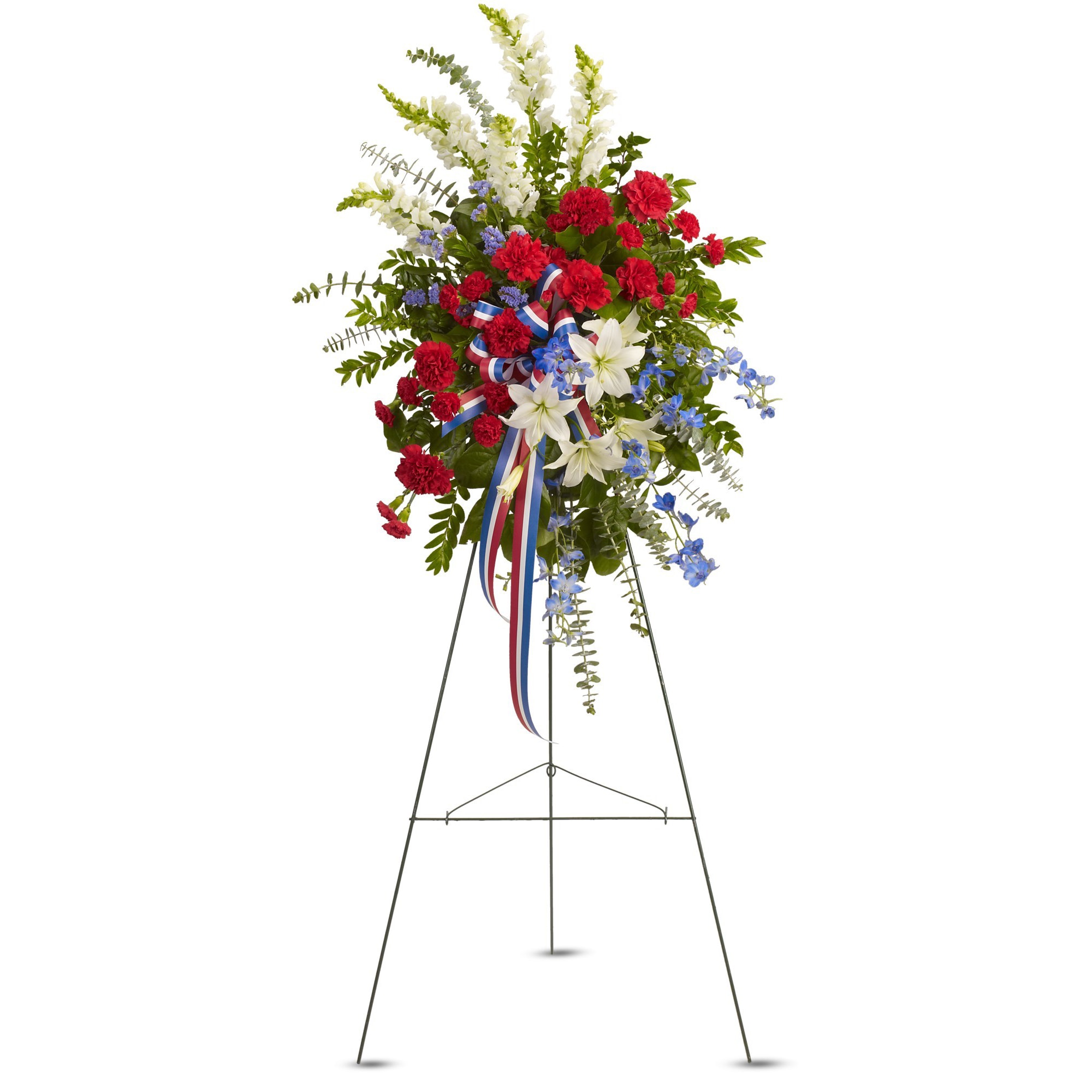 Standing floral spray with red, white, and blue flowers on an easel