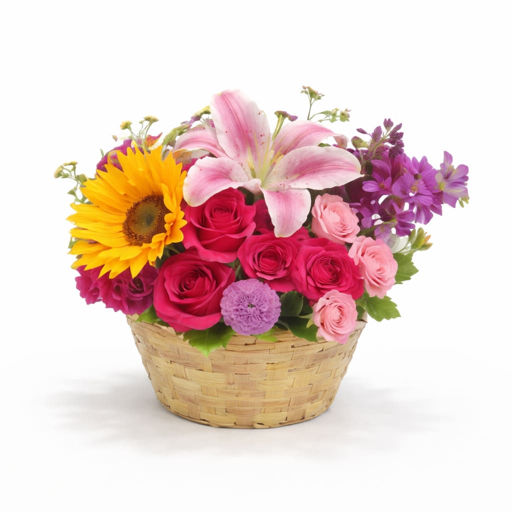 Bright Bloom Basket | Designer Choice - This cheerful arrangement is full of vibrant personality. Featuring a sunny mix of lilies, sunflowers, roses, and seasonal blooms in rich pinks, yellows, and purples—all tucked into a charming woven basket. It brings joy, warmth, and a whole lot of color to any space.   Perfect for: Spring, Mother’s Day, Birthdays, thank you gifts, get well soon, thinking of you  Note: Flower varieties and colors may vary slightly depending on seasonal availability, but the overall design and radiant charm will always be preserved.