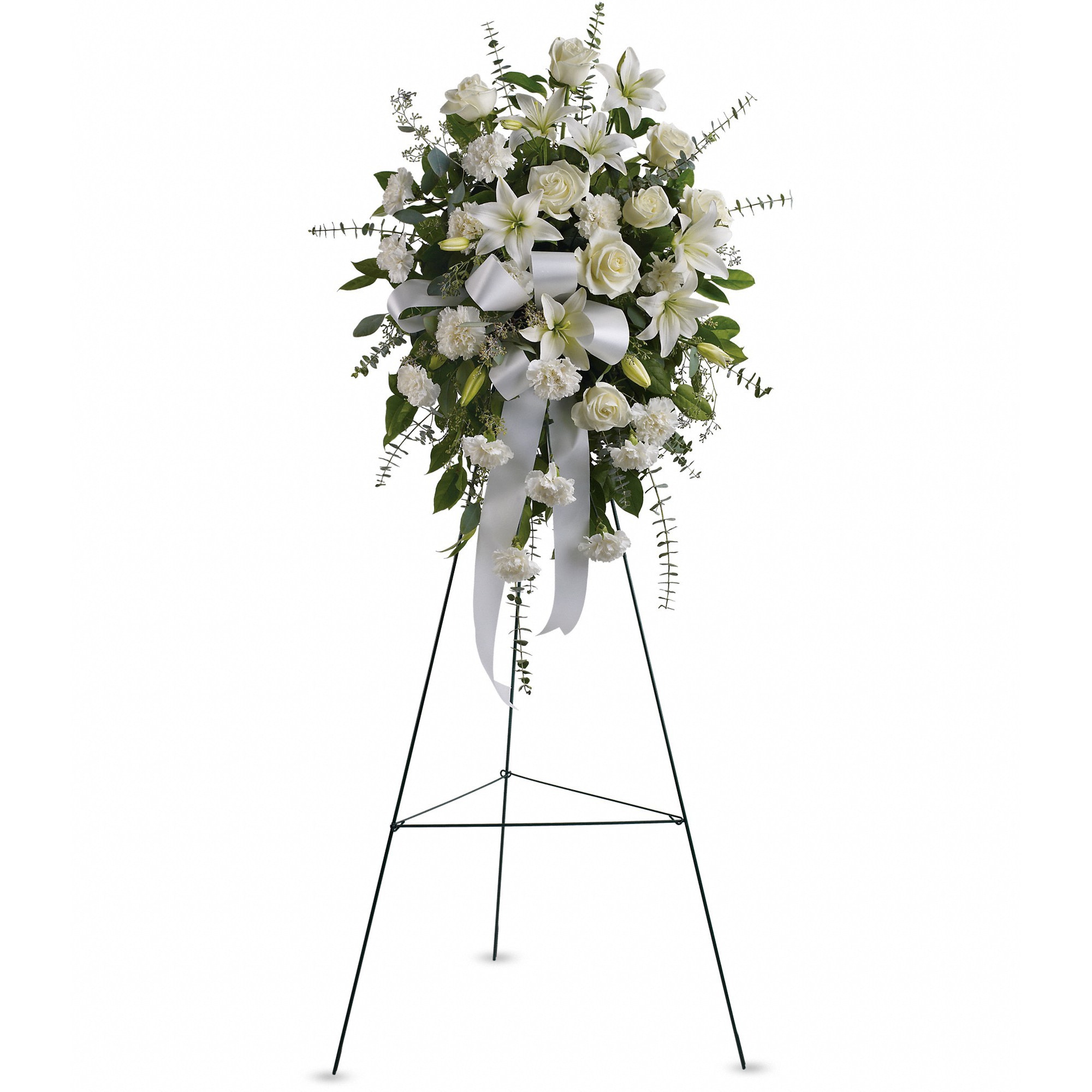 White floral standing spray on a black easel with ribbon
