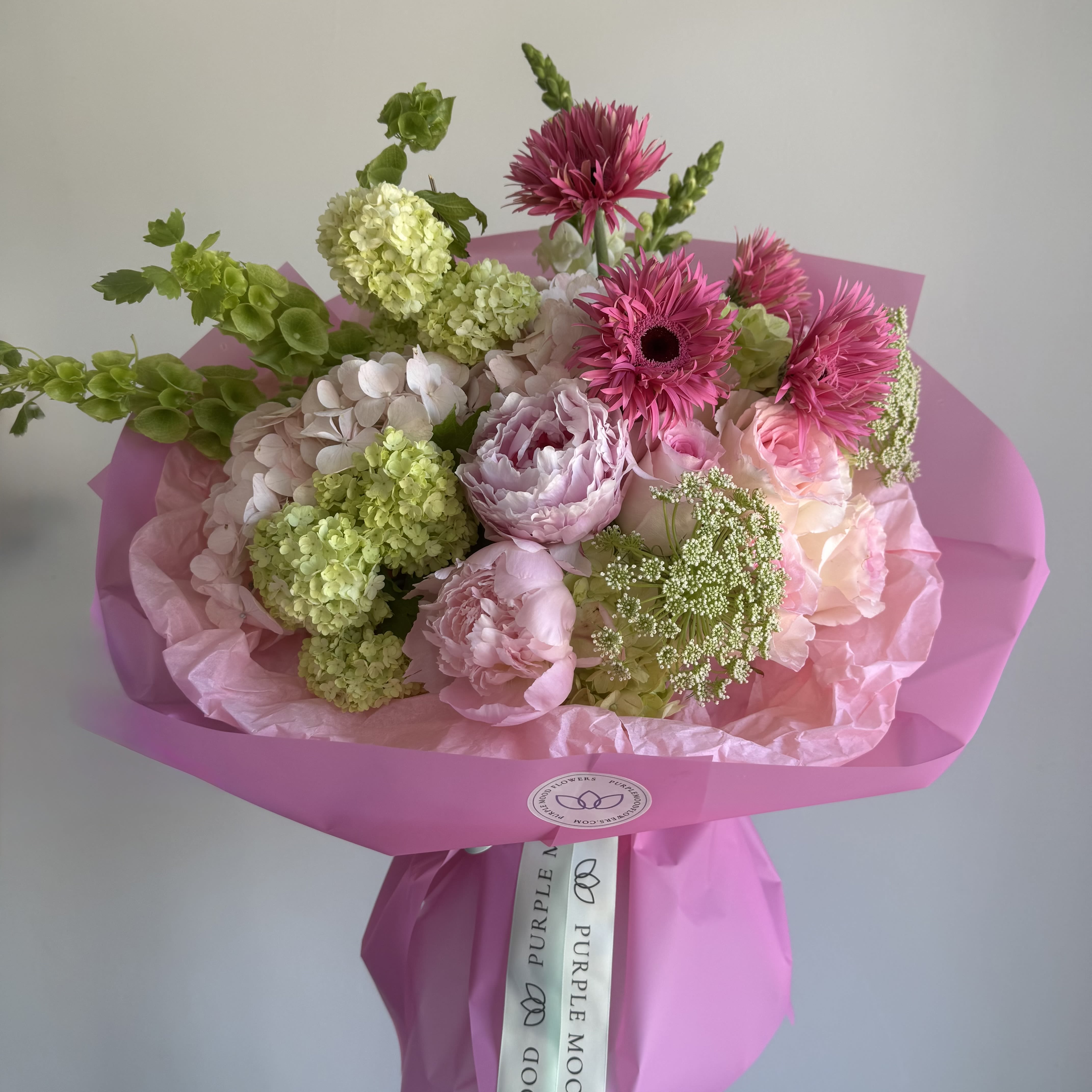 Mommy’s Love Bouquet - A soft and tender bouquet in delicate shades of blush and fresh green, designed to express warmth, care, and unconditional love. Featuring seasonal blooms arranged with a light, airy feel, this bouquet is a perfect way to celebrate the most important woman in your life. Vase not included. Bouquet comes beautifully wrapped.