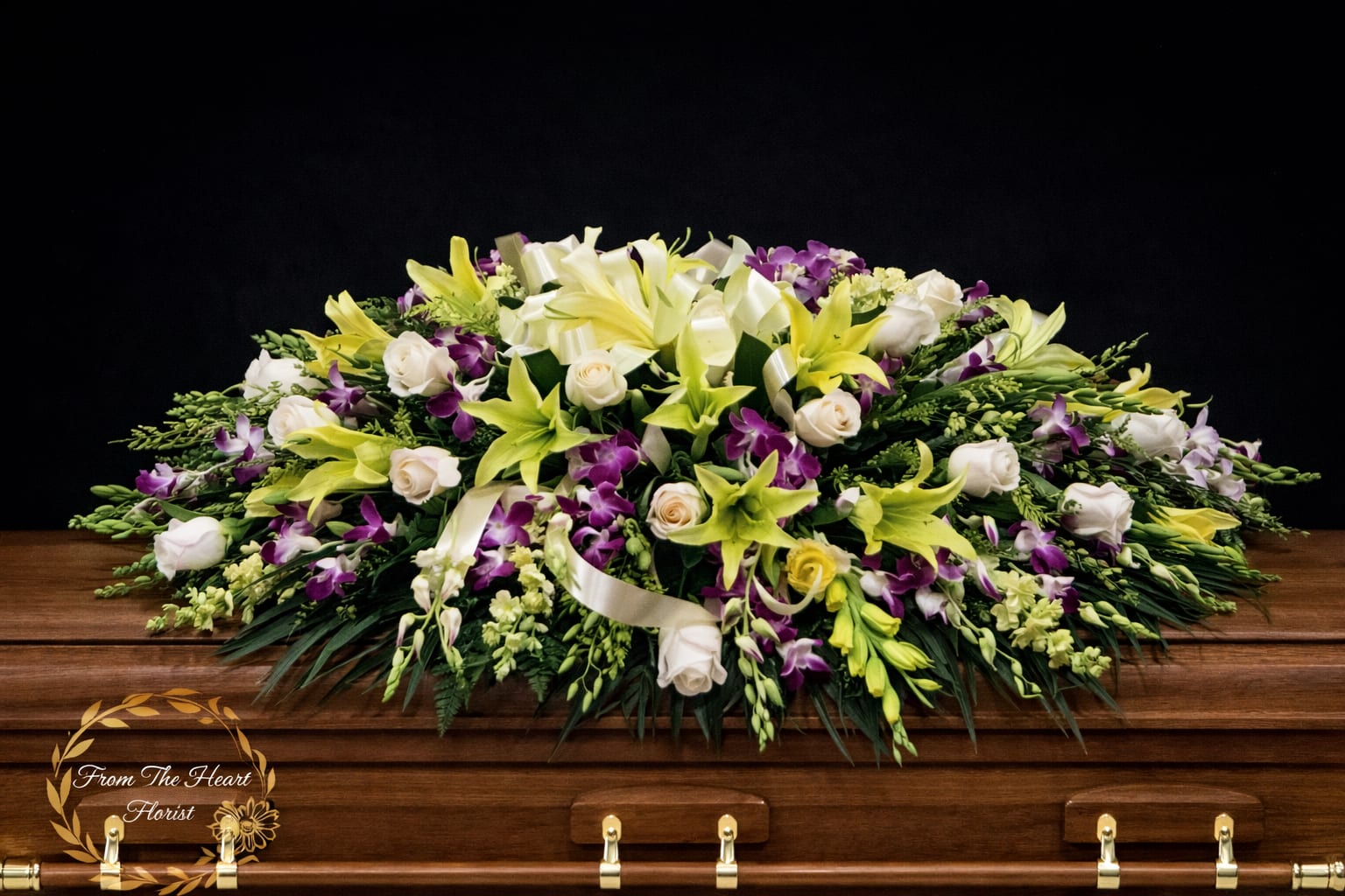 Orchid and Lily casket spray (FC10) - This casket spray make with purple dendrobium orchids and yellow wind lily and white roses