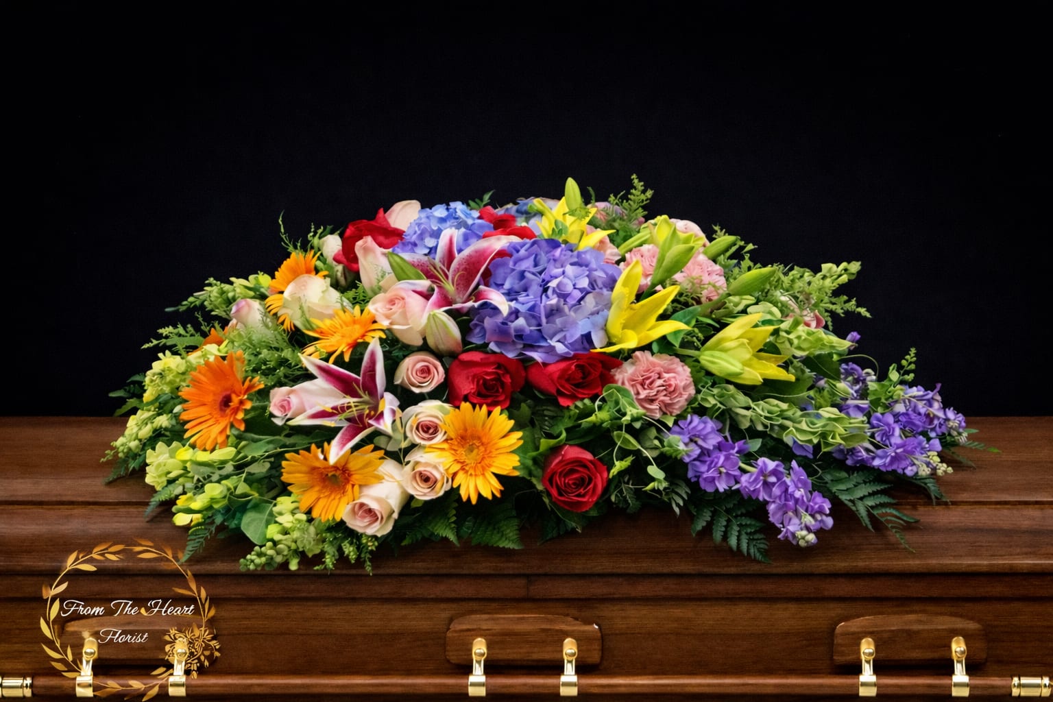 Sweet Garden Casket spray (FC11) - This beautiful casket spray make with lavender hydrangea and stock  , peach Gerber daisy , yellow lily and snap, pink roses and carnations