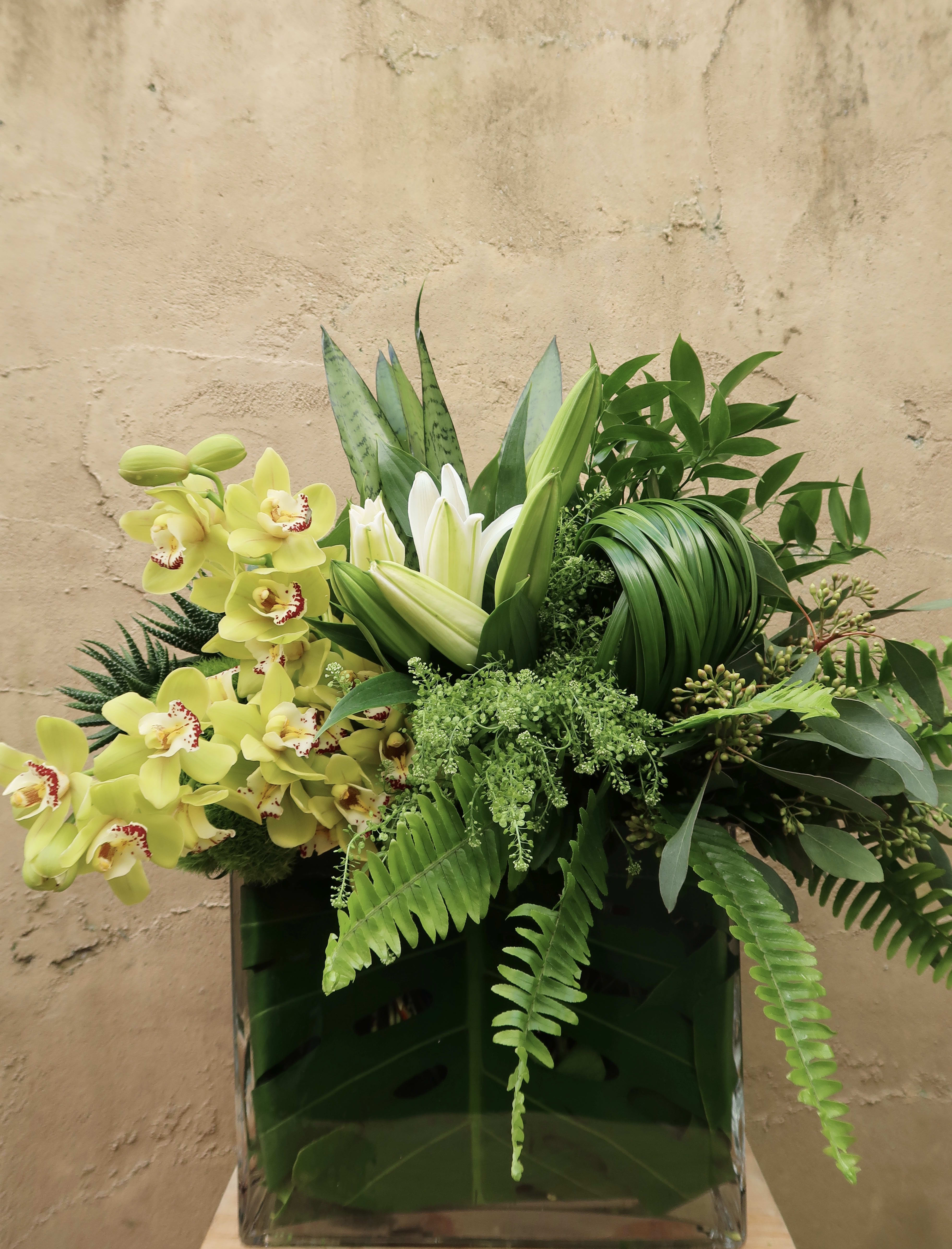 Green Goddess - An elegant arrangement of greens, orchids and Lillies, perfect for all occasions.