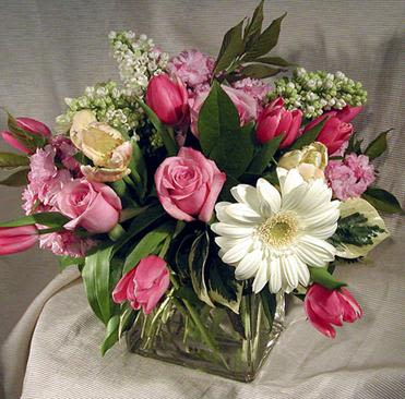 Classic - Timeless, elegant, and effortlessly beautiful   Our Classic arrangement brings together mini gerbera daisies, soft tulips, romantic roses, fragrant stock, and delicate alstroemeria—all perfectly styled in a clear square glass vase. It’s the kind of arrangement that never goes out of style and fits any occasion.  Simple. Stunning. Truly classic. 