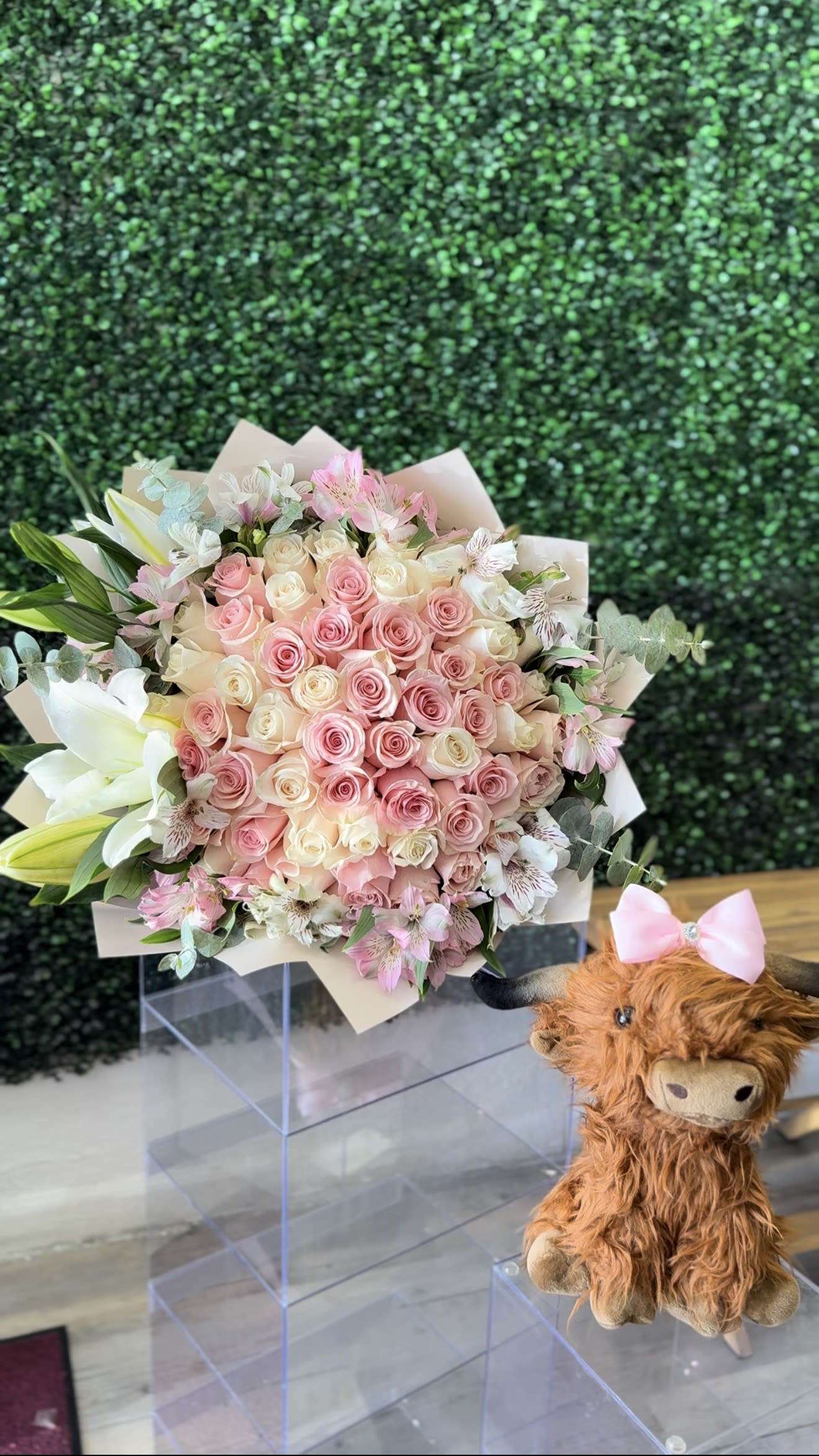 Enchanted Garden - ramo buchon 50 count rose with lilys eucalyptus alstromria rim