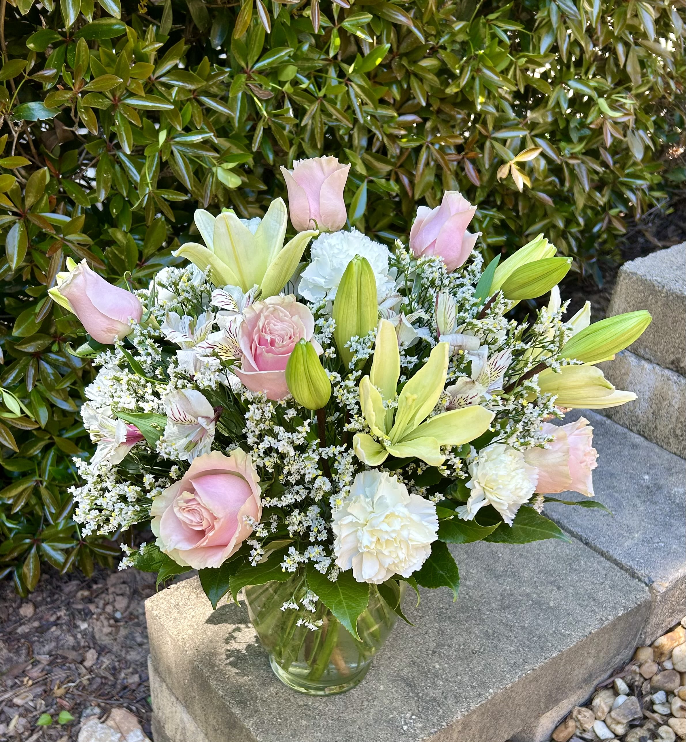 Springtime Grace - Fresh lilies and roses come together in a soft seasonal palette that brings elegance and renewal to any space.
