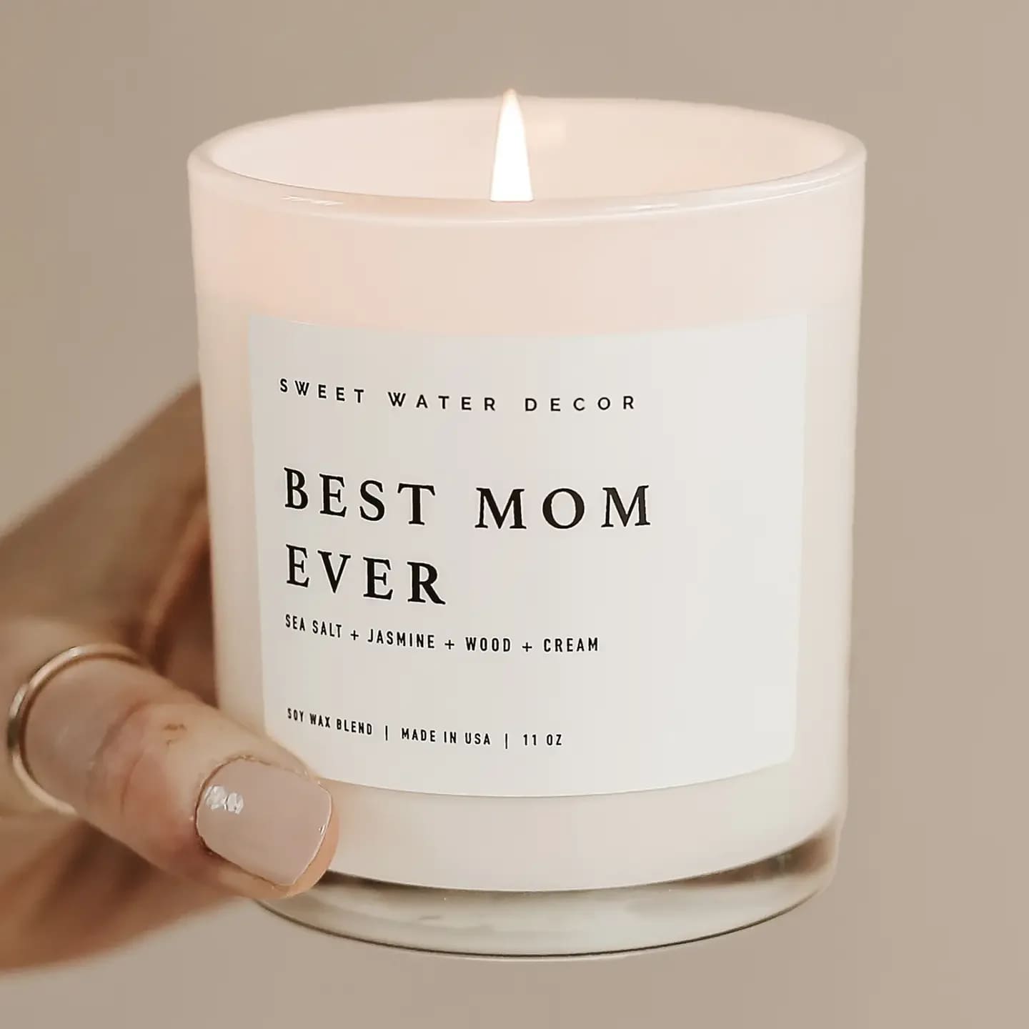 Best Mom Ever! 11 oz Soy Candle - Celebrate Mother's Day, Valentine's Day, and more with a gift for mom. Our relaxing Spa Day scent offers the relaxation she needs, and our white jar seamlessly goes with any space. Great for baby showers, baby announcement, and more!  SCENT NOTES: • Top: Sea Salt, Jasmine • Middle: Wood • Base: Cream  CANDLE INFO: • Size: Volume 11oz | 214g Net Weight | 3x3x3.5" • Burn Time: 50+ Hours • Wick: 100% Cotton (Lead and Zinc Free) • Wax: Proprietary Soy Based Wax Blend | Vegan, Non-GMO, Kosher Premium Fragrance Oil • Gluten Free, Phthalate Free, Non-Toxic • Made in Pittsburgh, PA • Style No. WJ002