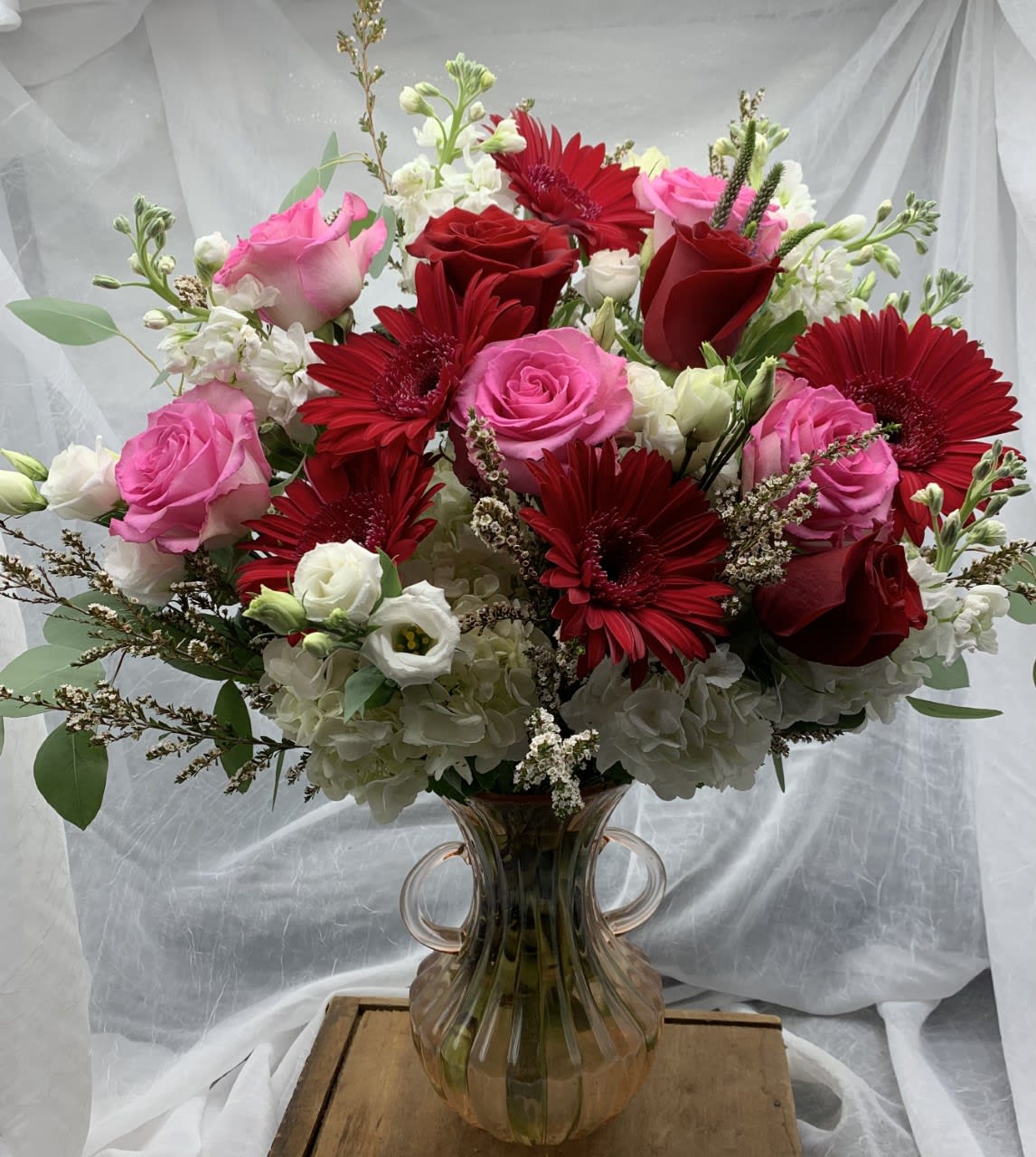 ALL MY LOVE (FEATURED DESIGN)   $200/250/300 - Beautiful Valentine design in a tall traditional vase of pinks, reds and whites.  This arrangement features long stem premium roses in red and pink, Gerbera daisies, Lisianthus and Stock. Pictured at regular price but may be upgraded to deluxe or premium.  PS: Don't forget to add a candle and some chocolates!