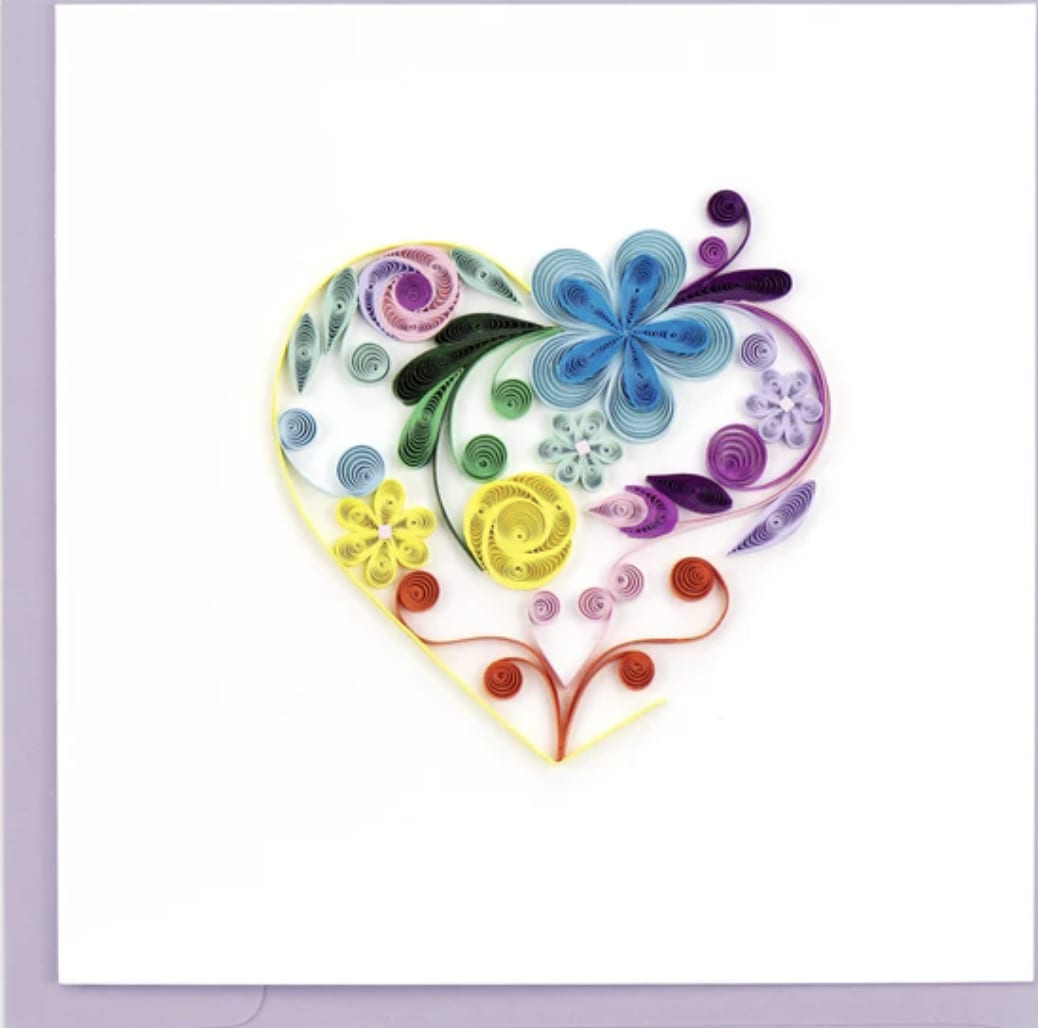 Greeting card with a rainbow quilled paper heart filled with stylized flowers on a white background