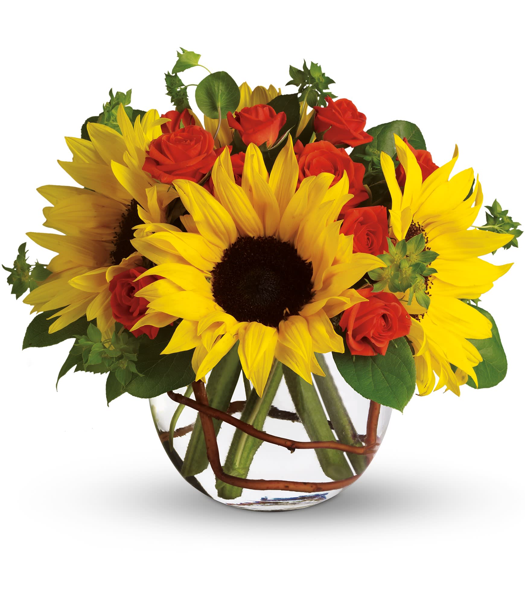 Sunflowers and red roses arranged in a clear glass vase