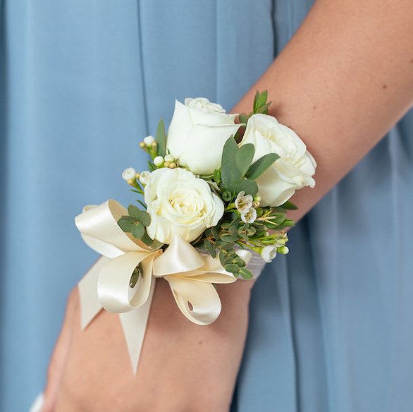 White rose wrist corsage with cream ribbon