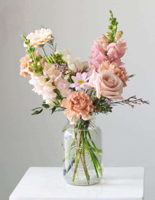 Peachy Keen Arrangement - This charming garden-style arrangement features a soft, pastel palette of peaches and pinks.
