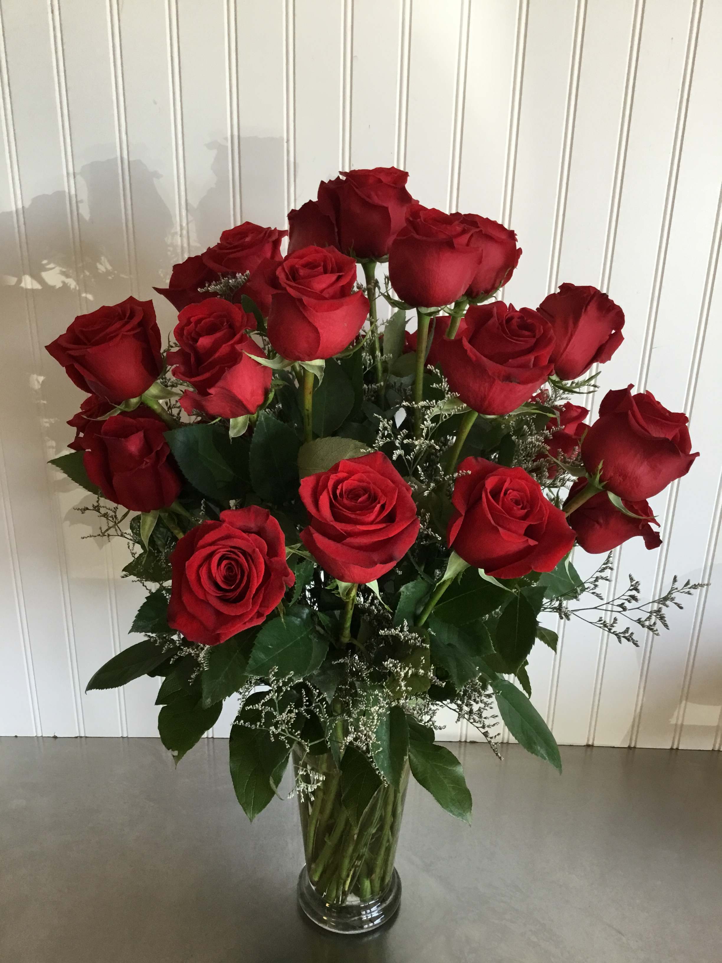 Bouquet of red roses in a clear glass vase