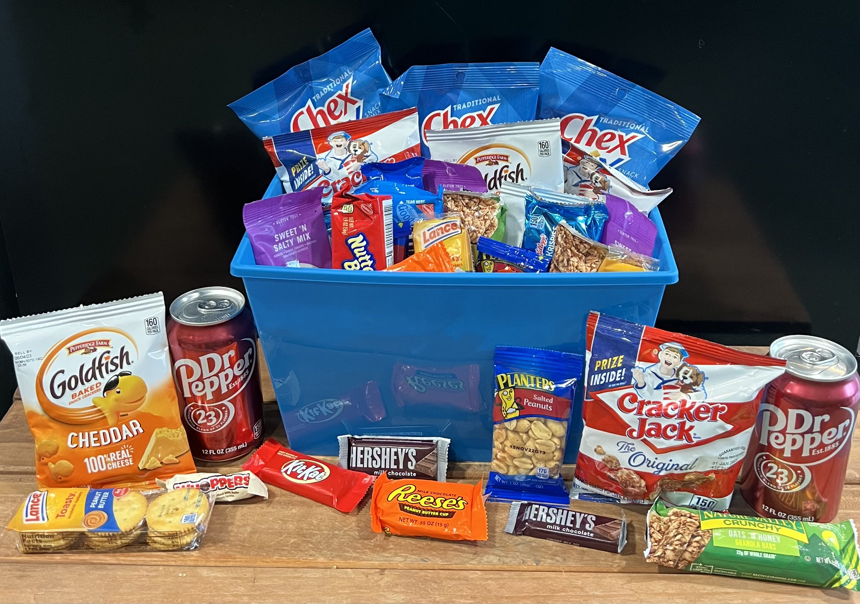 Snack Basket - Send a basket of snack foods including cookies, pretzels, Goldfish, crackers, nuts, Chex Mix, granola bars, candy, soft drink &amp; more. Order this basket online or call to personalize it with the recipient's favorites! Special requests need 48 hour advanced ordering.  Available for local delivery only.