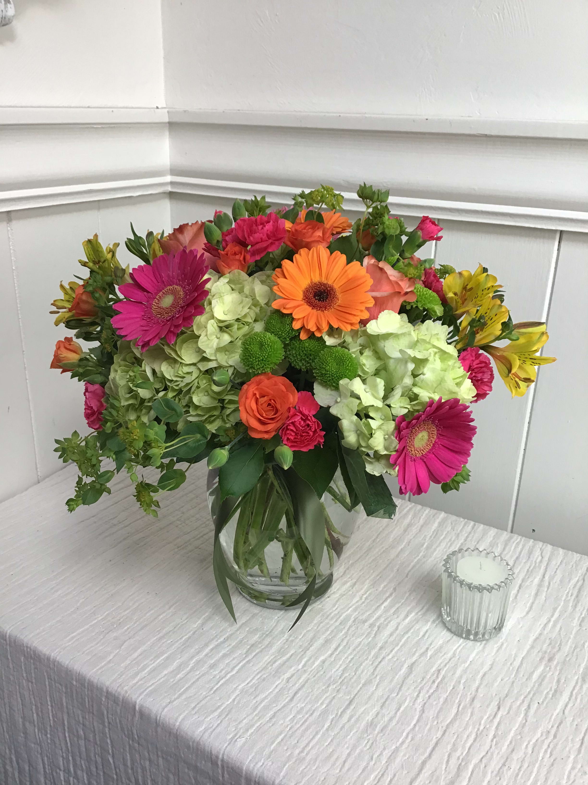 Colorful mixed bouquet in a clear glass vase