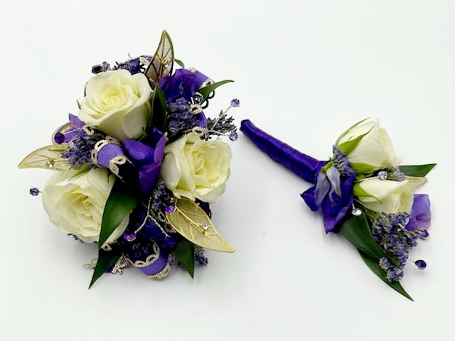 White rose bouquet and matching boutonniere with purple ribbon