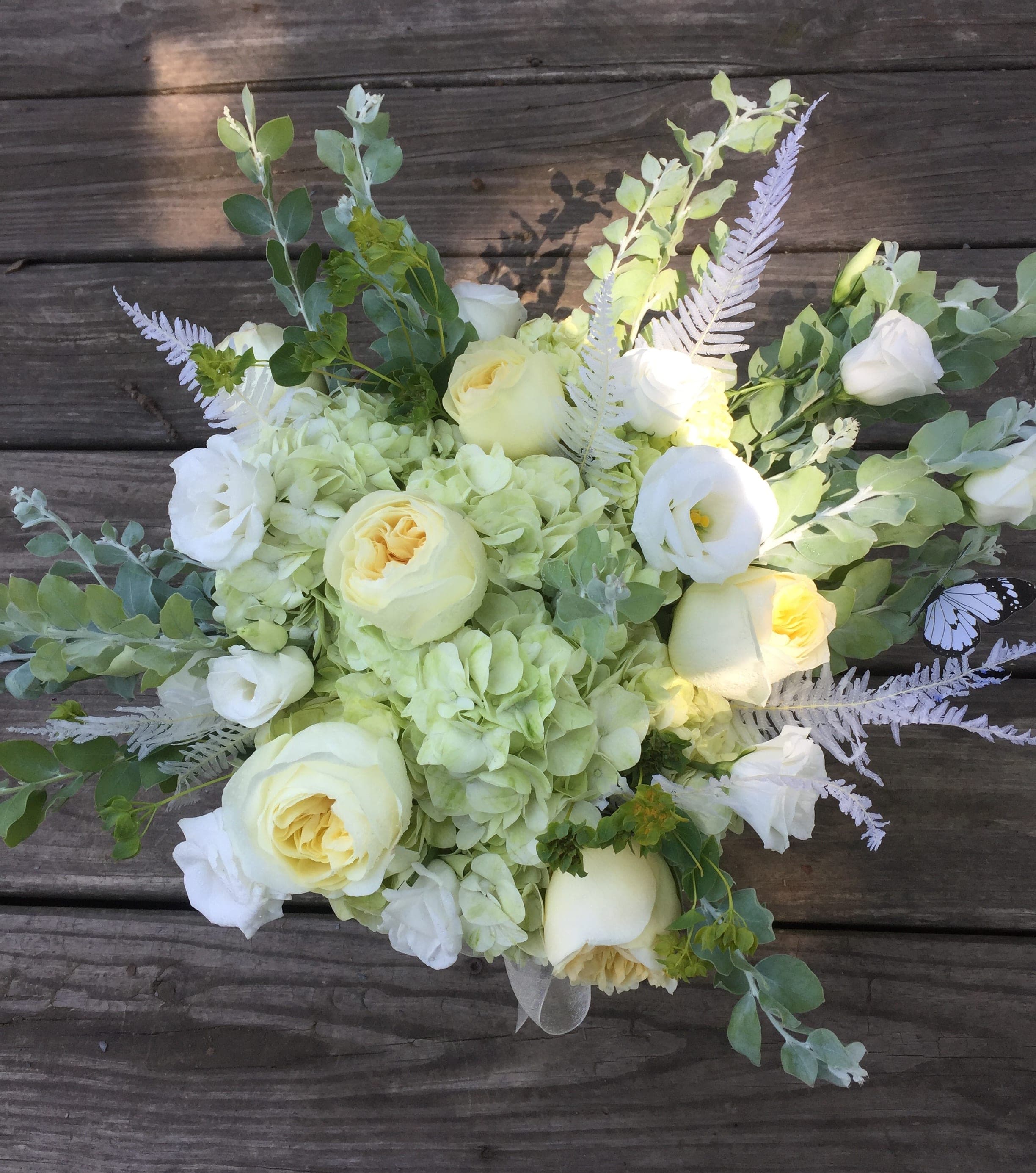 White and pale yellow bouquet with hydrangeas and roses