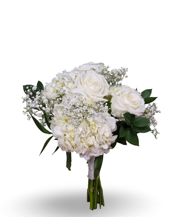 Simply Elegant Posy - A compact, hand-tied event posy built from large white roses and clustered white hydrangeas-this Simply Elegant Posy reads as timeless and refined for prom or weddings. The mostly white palette with touches of airy baby's breath and deep green foliage creates a soft, luminous look that makes the person you're honoring feel seen and comforted.   This round, full bouquet is designed to be carried-glossy green leaves peek around the edges to frame the blooms and add contrast against dresses or formal attire. Size and handling suit bridal parties or prom festivities; stems are bound for easy carrying and simple care: keep stems trimmed and in fresh water until the moment of presentation.