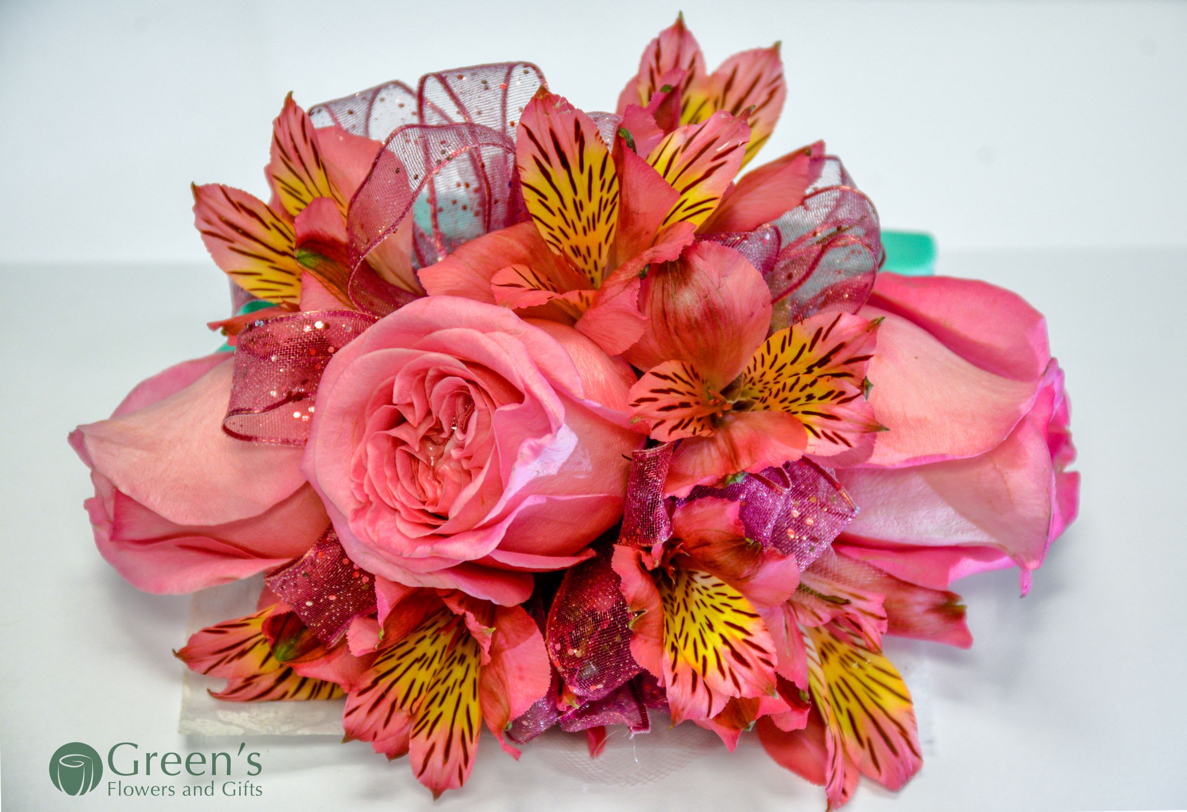 Pink rose bouquet with striped alstroemeria and glittery ribbon