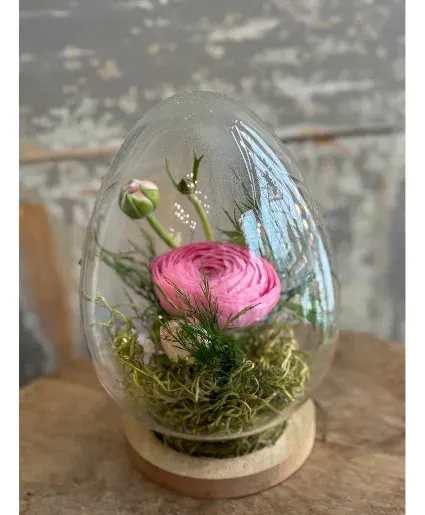 Spring Bloom Easter Egg Terrarium - Fresh cut spring blooms with moss in an egg shaped glass terrarium. What a wonderful hostess gift or way to let someone know you are thinking of them this Easter. Please let us know if you have a flower and/or color preference.