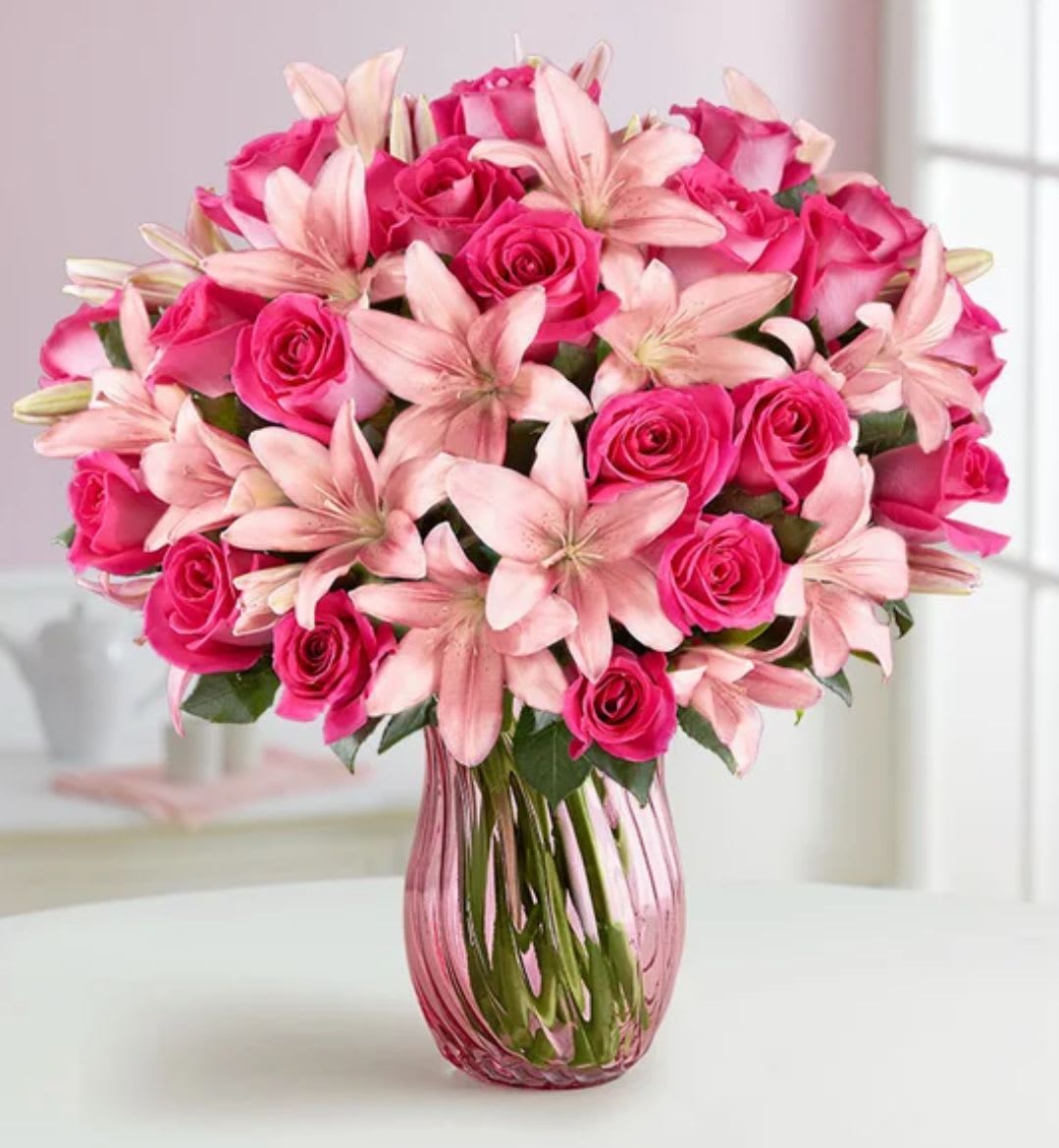 Blushing Beauty Bouquet – Elegant Pink Birthday Flowers Bronx - The Blushing Beauty Bouquet is a stunning celebration of softness, joy, and elegance. Featuring pink roses, white lilies, and delicate carnations, this pastel-toned arrangement captures warmth and grace in every petal. Accented with fresh greenery and arranged in a sleek glass vase, it’s the perfect way to say “Happy Birthday” or simply brighten someone’s day. Handcrafted with love by 1800 Blooms, and available for same-day delivery throughout the Bronx, NY