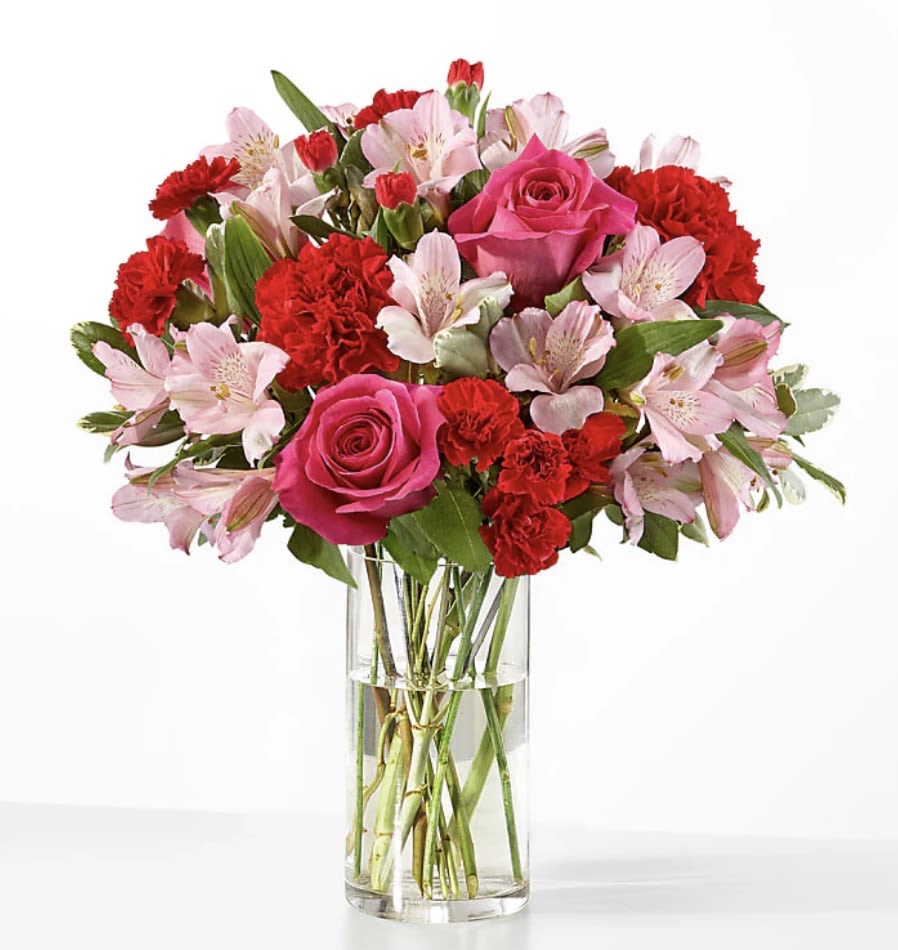 Romantic Elegance Bouquet – Premium Anniversary Flowers - The Romantic Elegance Bouquet is the perfect expression of timeless love and sophistication. Featuring a luxurious blend of red roses, pink lilies, and lush greenery, this arrangement captures both passion and tenderness in every petal. Expertly designed to convey romance and elegance, it’s ideal for anniversaries, special celebrations, or simply saying “I love you” in the most unforgettable way. Handcrafted by 1-800 Blooms and available for same-day delivery throughout the Bronx, NY.