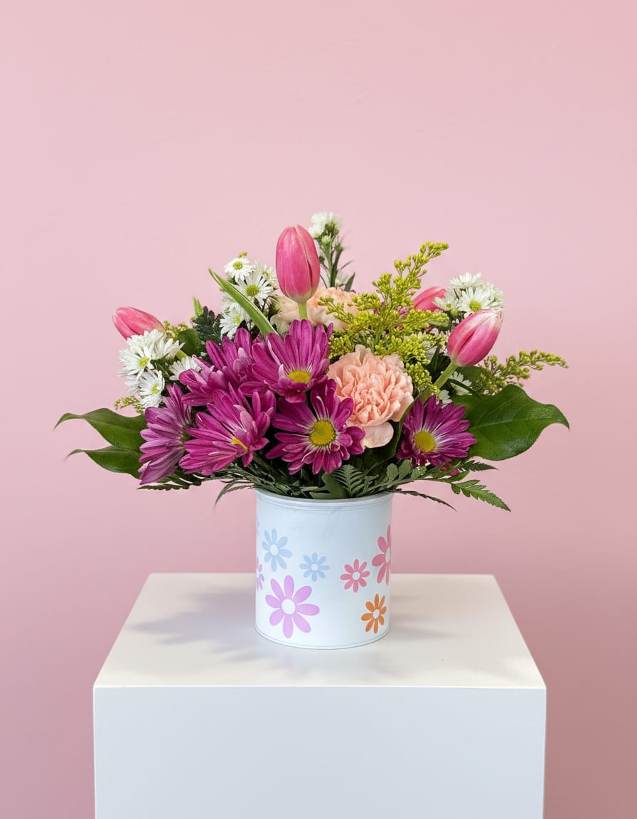 Daisy Mae - This cute daisy container brings fun to the home with the mix of flowers