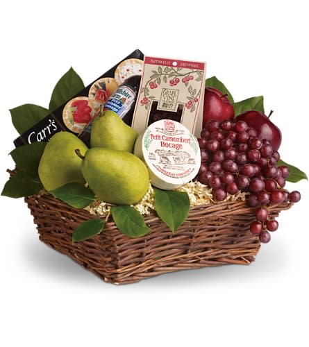 Gift basket with pears, grapes, cheese, and crackers in a wicker basket