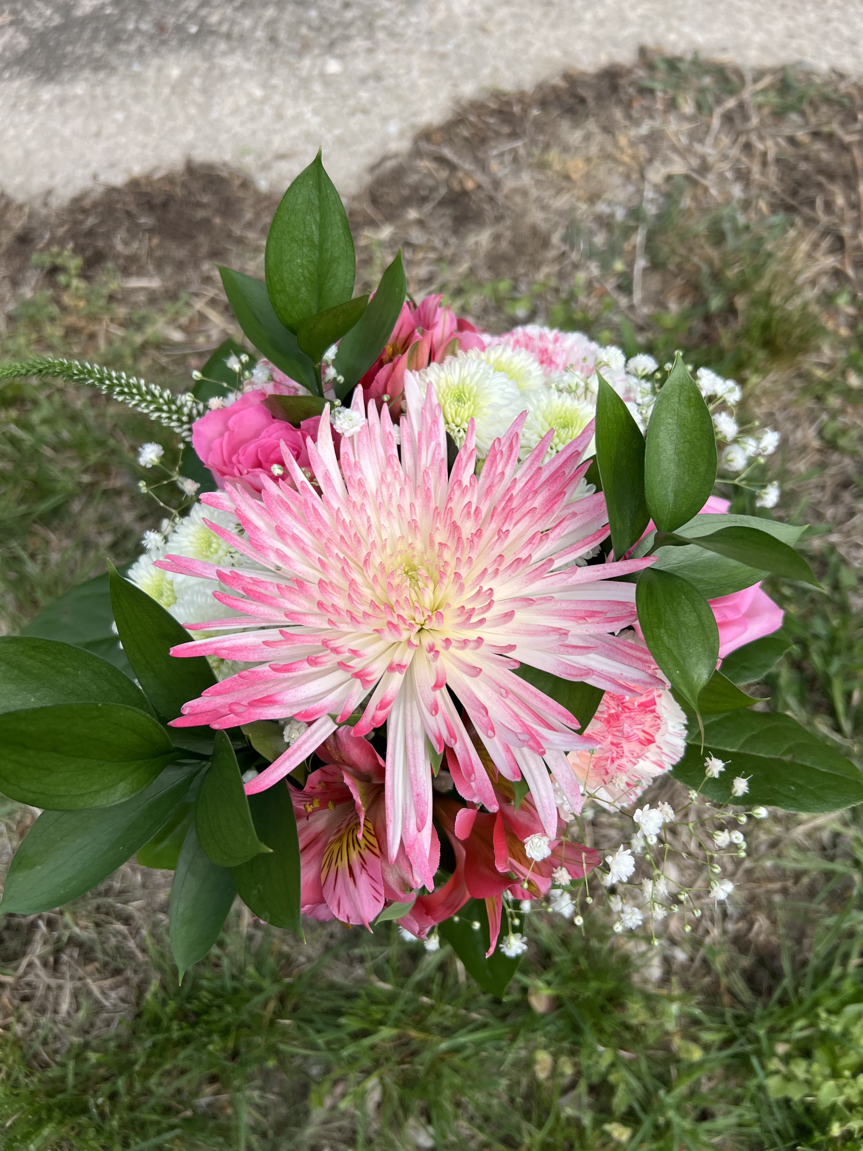 Shades of Pink Handheld Bouquet - An elegant hand-tied bouquet that will compliment any prom outfit. Filled with mixed flowers such as roses, daisies, and alstroemeria. *Vase not included*