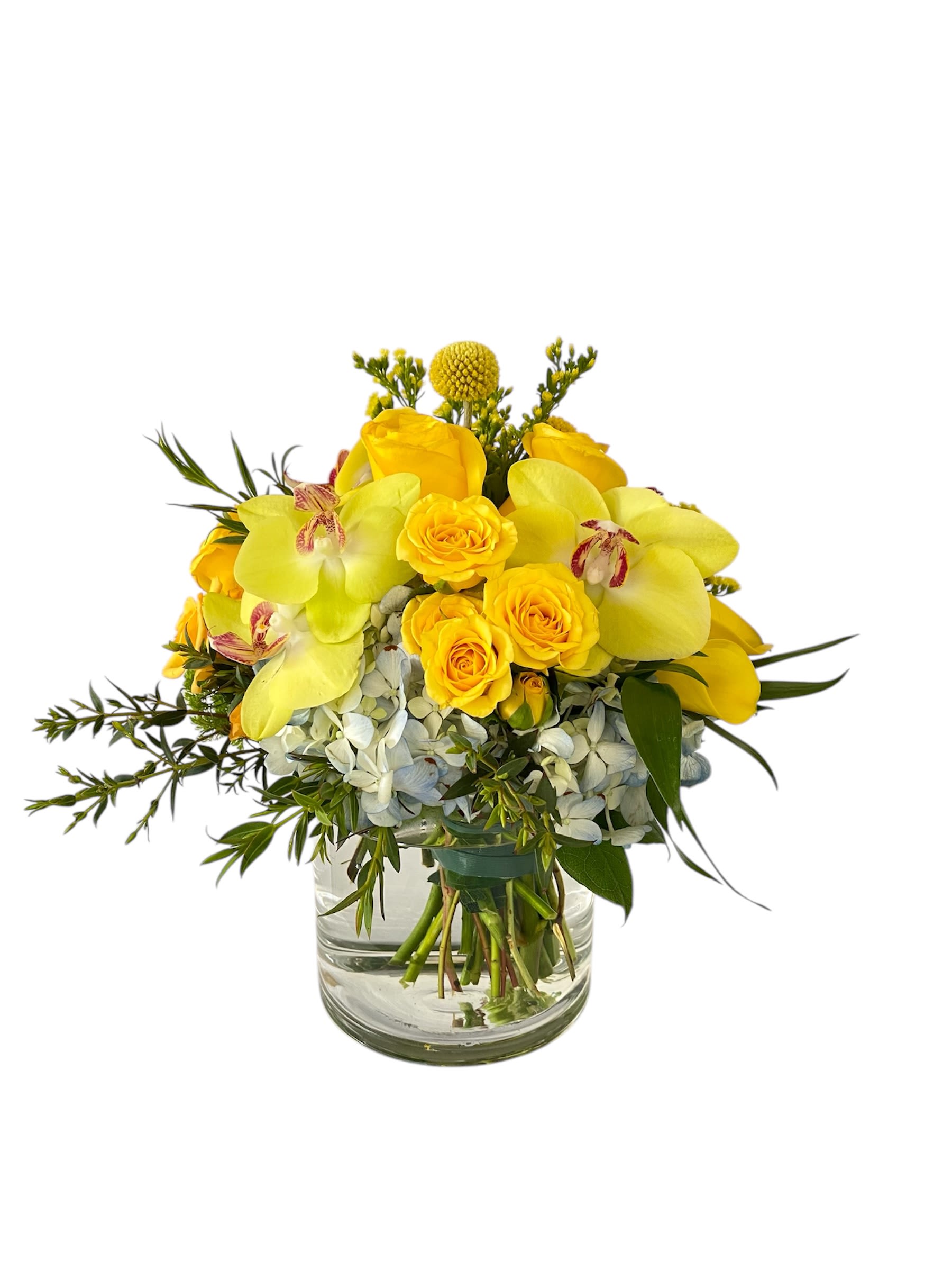 Yellow roses and orchids arranged in a glass vase