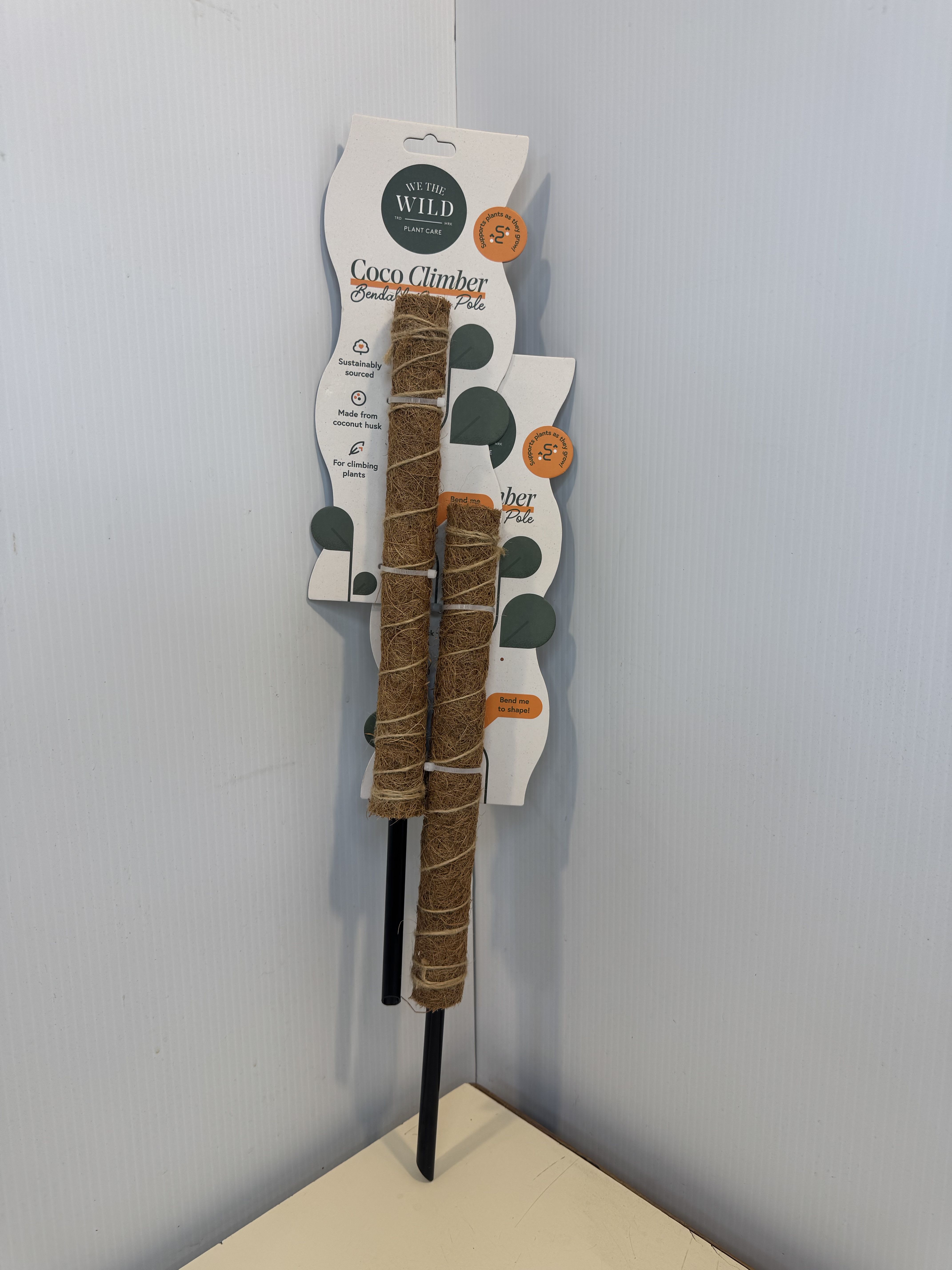 Packaged coco climber plant support poles on display