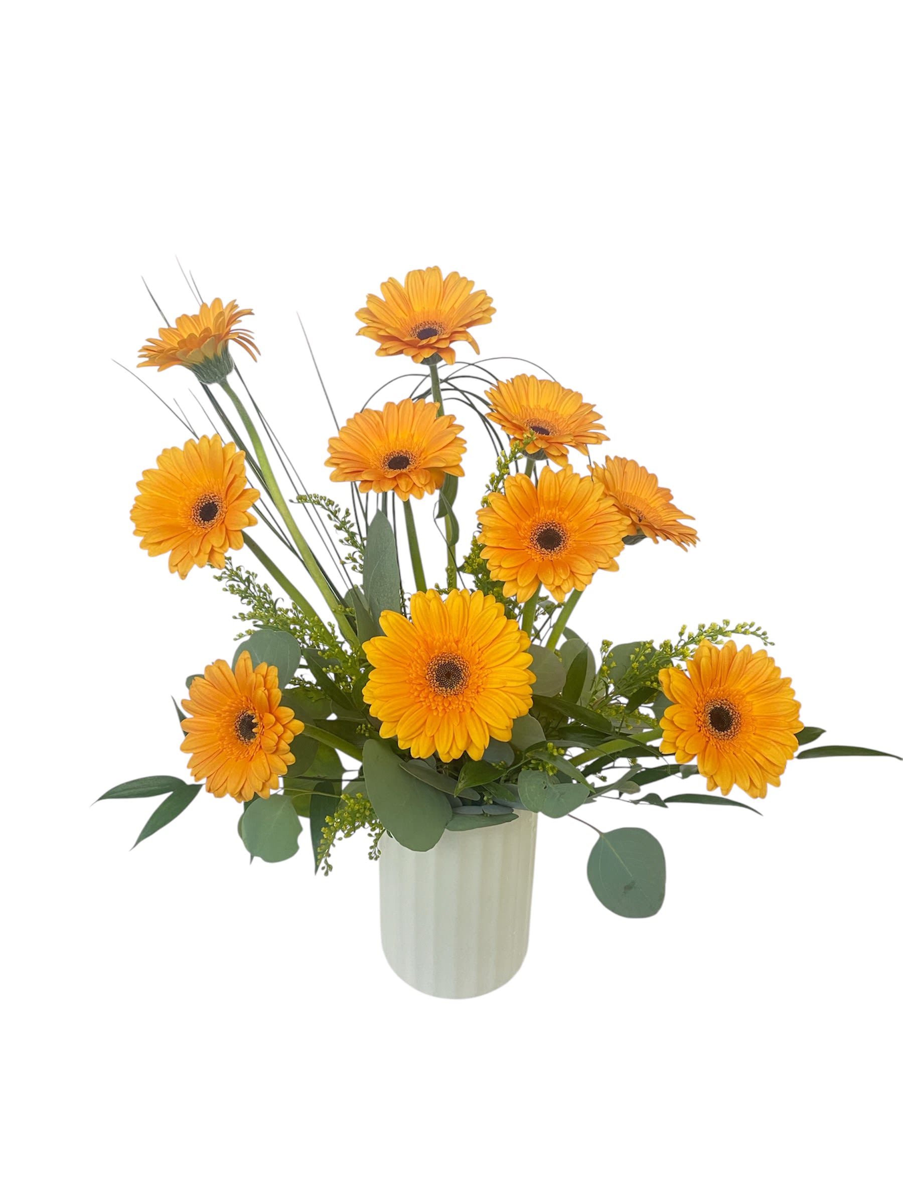 Orange gerbera daisies arranged in a white vase