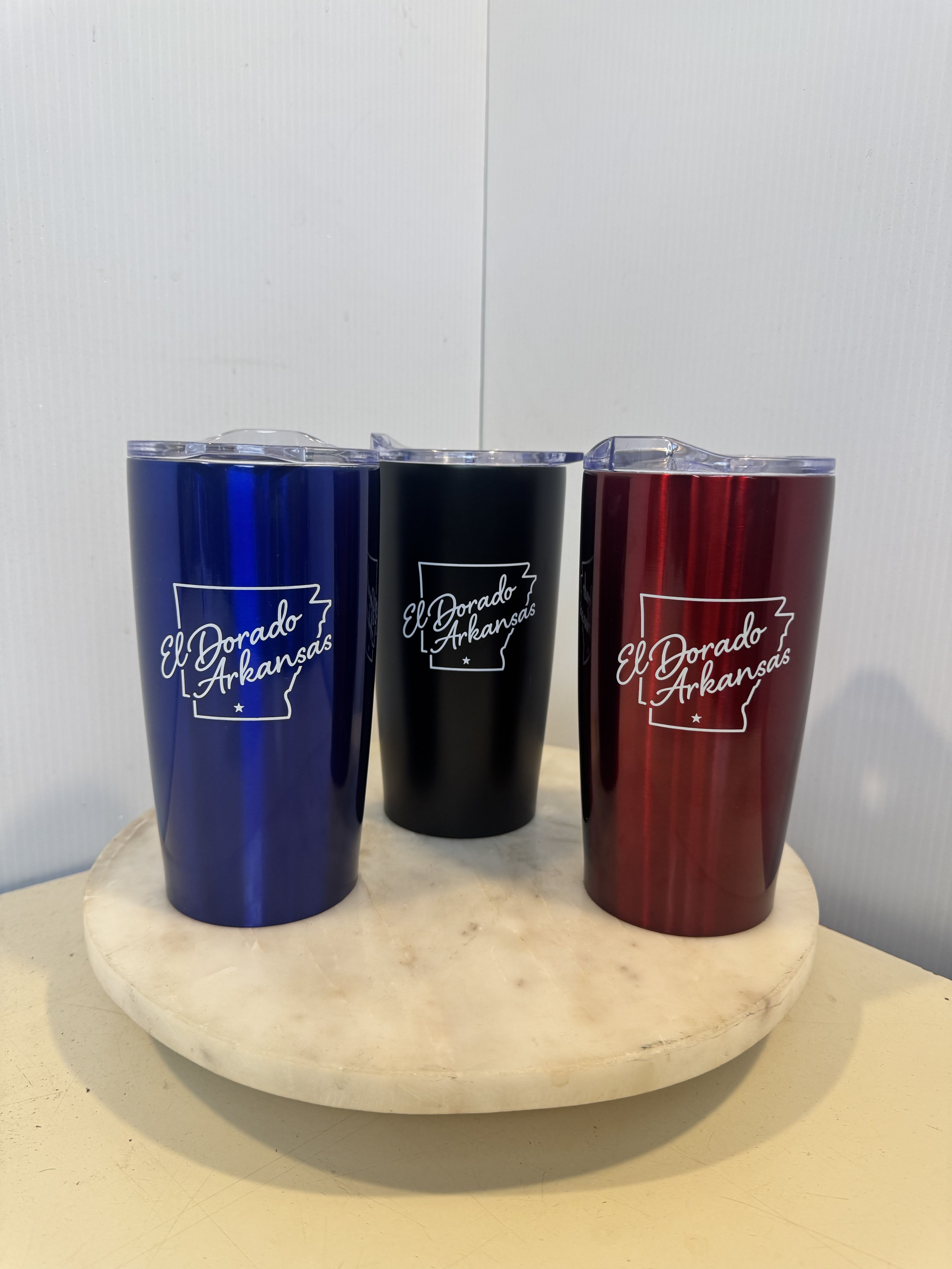 Three insulated tumblers with El Dorado Arkansas logos