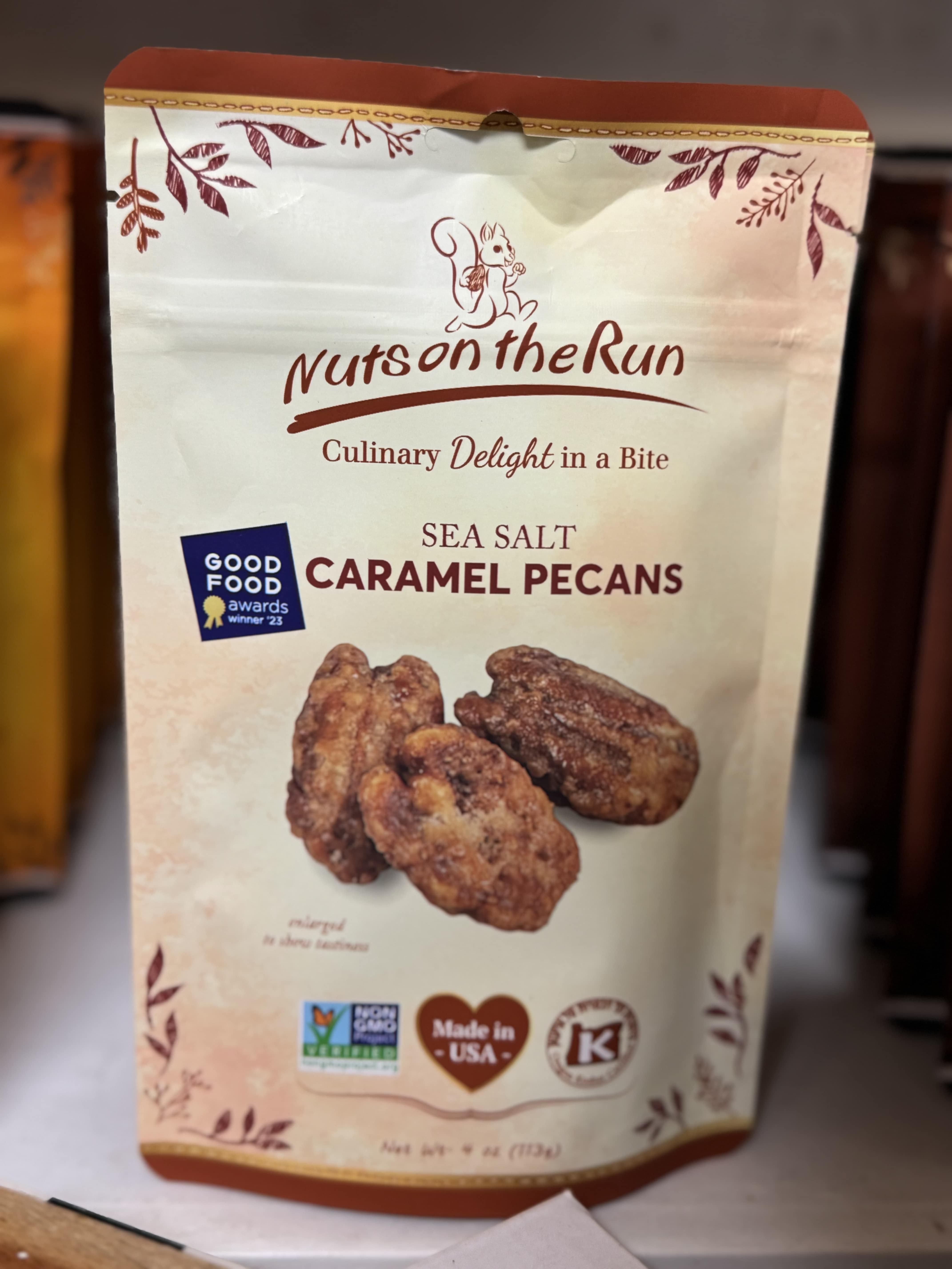 Bag of sea salt caramel pecans with a nut image on the front