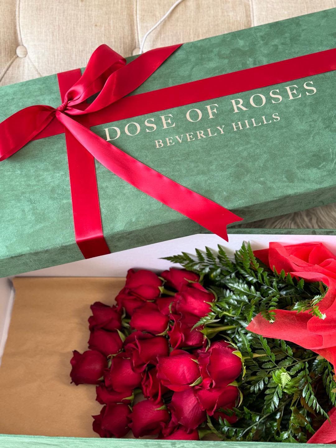 Box of red roses tied with a red ribbon