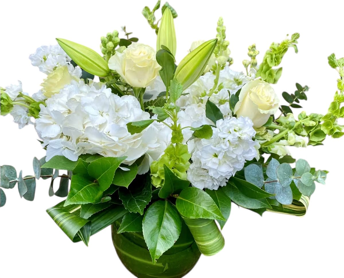 Love Grows Here - Lovely arrangement of white and green blooms. Expertly arranged in a sophisticated thick leaf lined glass vase 