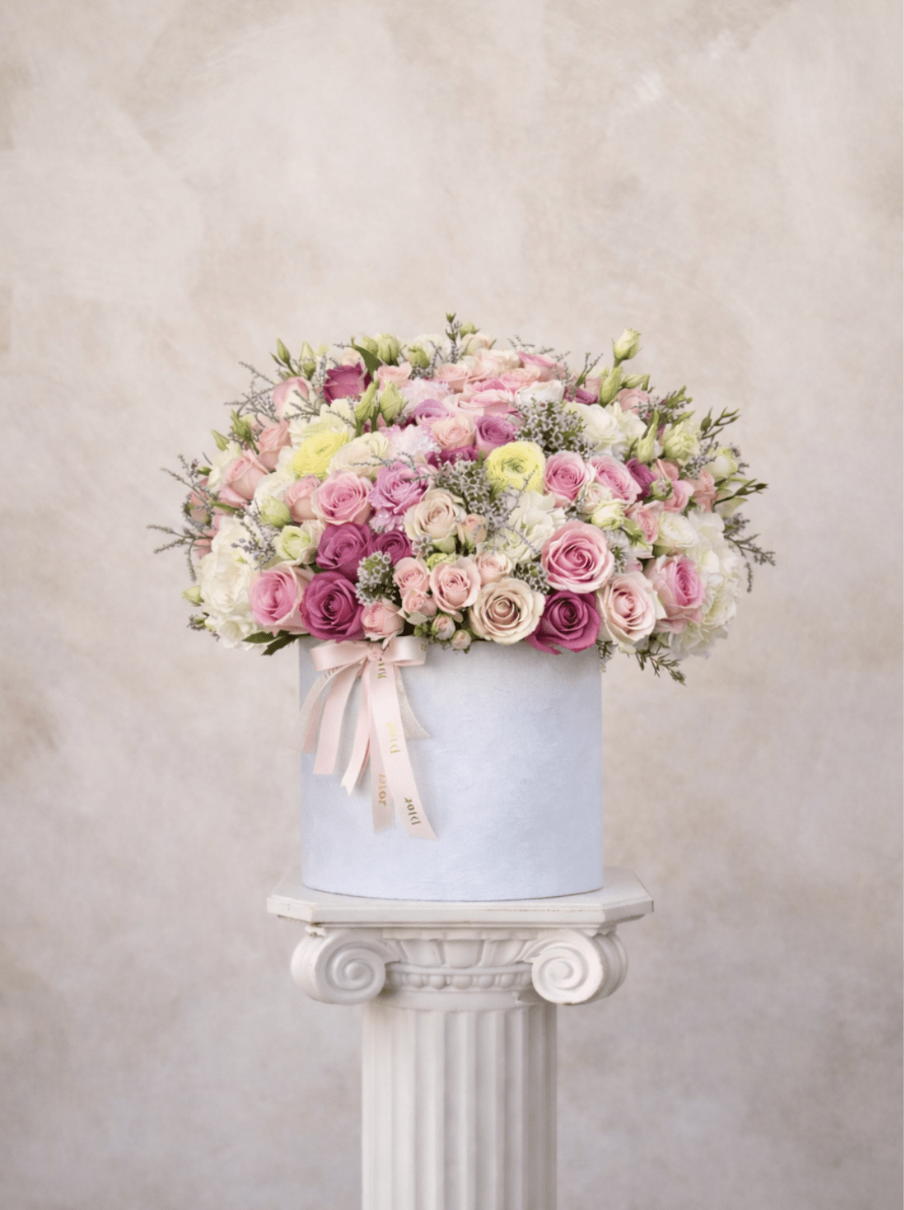Blossom blooms  - Brighten any space with our Elegant Flower Box Arrangement! Bursting with vibrant blooms, this stunning display combines seasonal favorites with lush greenery.   Housed in a chic, reusable container, it makes a perfect centerpiece for any occasion be it a gift or a treat for yourself. Elevate your decor with this captivating arrangement that brings joy and sophistication to your home or office. Order yours today and let the beauty of flowers inspire you