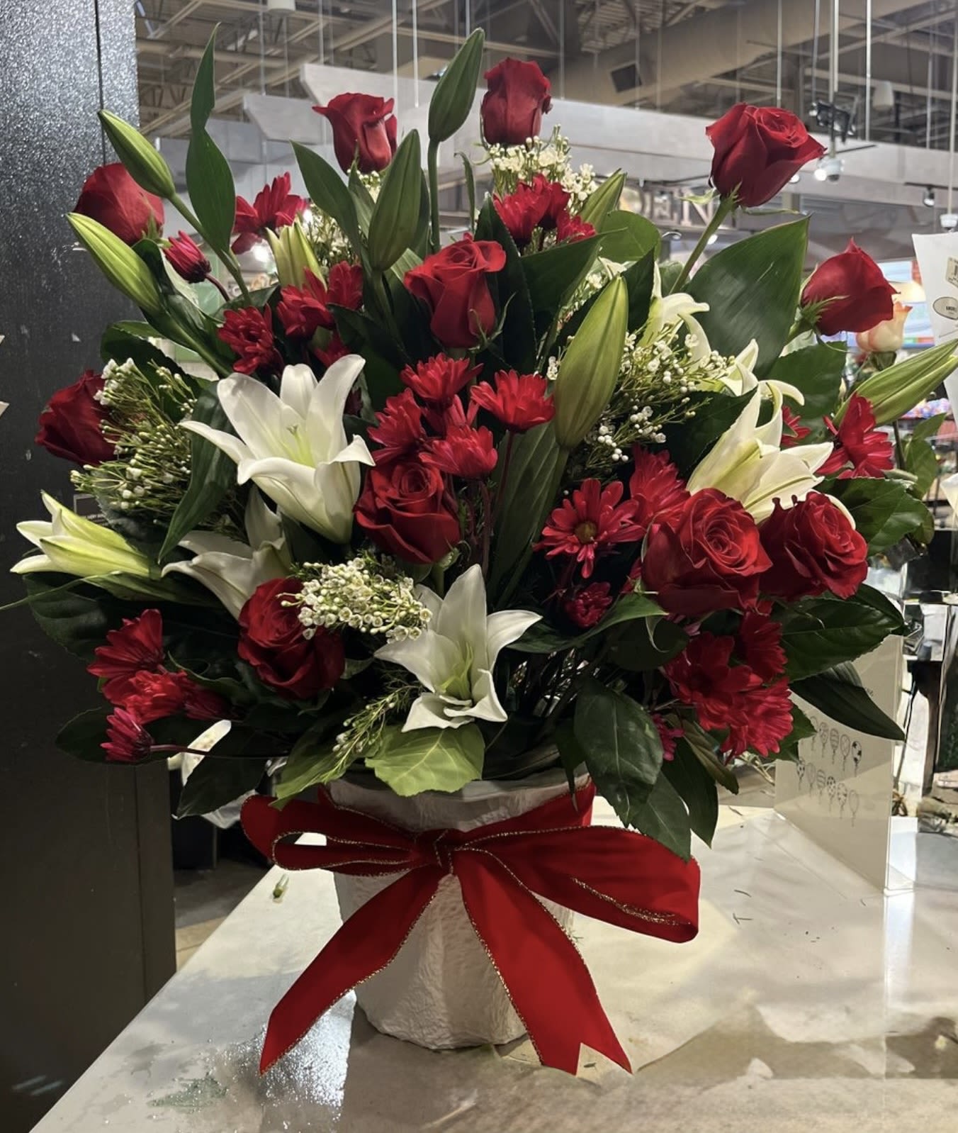 Lilies and Roses gift  -  Elegant Luxury Floral Arrangement   Make every moment unforgettable with this stunning arrangement of fresh red roses, pure white lilies, and vibrant seasonal blooms. Designed with love and elegance, this bouquet is perfect for birthdays, anniversaries, romantic surprises, congratulations, or simply showing someone how much they mean to you.   Fresh premium flowers  Handcrafted with care  Beautiful luxury vase included  Same-day delivery available  Give the gift of beauty, love, and unforgettable memories.  Order now and let flowers speak from the heart! ️