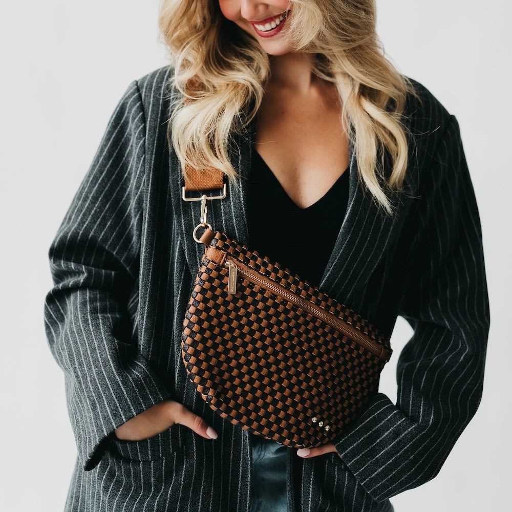 Black/Brown Leather Bum Bag - Meet the Westlyn Woven Bum Bag! Gorgeous woven vegan leather! Beautiful hardware with a zipper closure with beige and black chevron interior, and a zippered slash pocket on the inside. This crossbody bag is the perfect accessory to elevate any outfit! Available in 25 colors perfect for your everyday, date night, game day, travel and more!   Measurements: 12"L x 8"H x 24"-46" strap