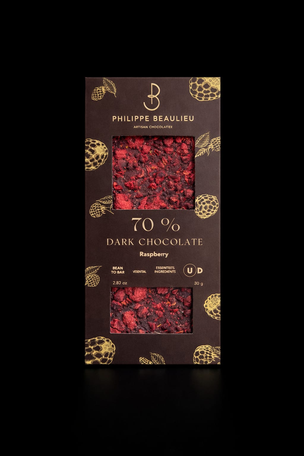 Box of dark chocolate raspberry bar with visible fruit pieces