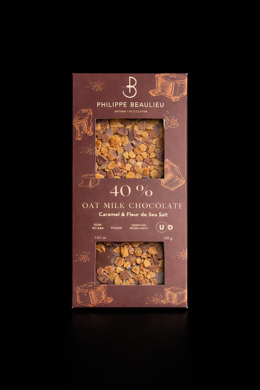 Milk Chocolate - Warm, artisanal and dessert-like, this gift-ready arrangement pairs a boxed milk chocolate bar with a cozy neutral palette-brown and white tones that read like a sweet, sophisticated treat for birthdays or thank-you gifts. As a gift arrangement for someone who savors small luxuries, it sends a clear message: you're thought of and well-loved. The presentation feels intimate and handmade, perfect for celebrating a friend, colleague, or sweet someone on their special day.  The included chocolate bar is a boxed 40% oat milk chocolate with caramel and fleur de sel, shown through two clear windows in warm brown packaging with caramel-toned illustrations. The hard good adds weight and an edible focal point to the arrangement, complementing neutral florals and accents in the same color family. Order to gift right away-this selection is ready to present as a tasteful birthday, thank-you, or just-because surprise that will make the recipient feel truly seen.