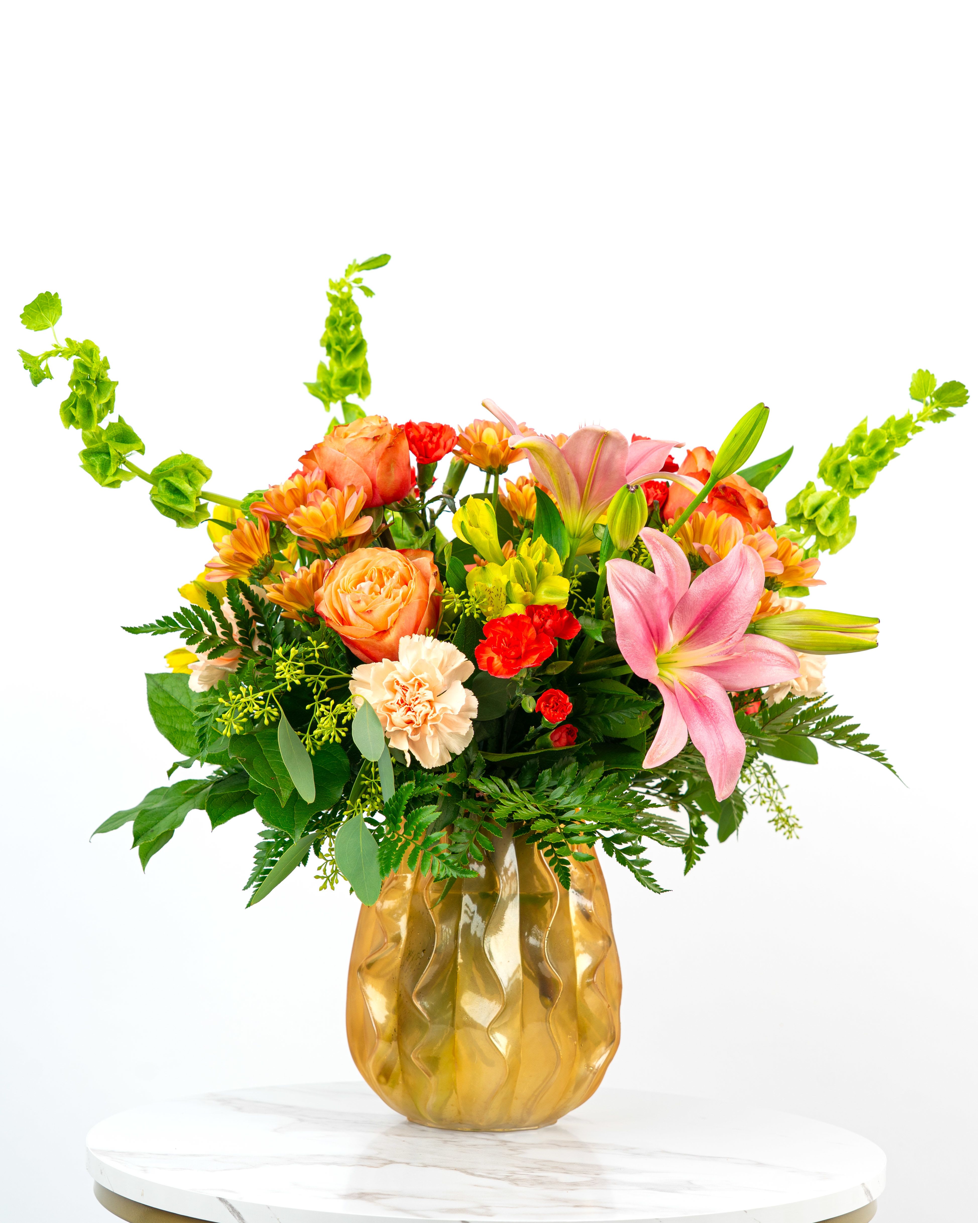 Our Rosy Collection: Premium Tropical Wishes  - Looking for a festive and feminine way to wish someone special a Happy Birthday? Our Rosy Collection's Tropical Wishes is intended to celebrate someone special with cheerful color combinations in yellow, coral, pink and/or orange (tropical colors). At Schultz Floral, each arrangement is one of a kind and styled just for your order. Because we always use the freshest blooms, your final arrangement may not look exactly as pictured due to seasonal availability.