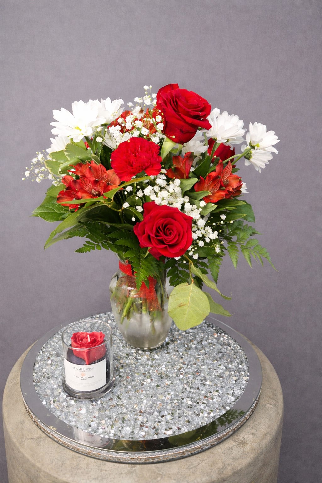 Rose and Bloom Bundle  - Red roses with white daisies, alstroemeria and carnations in a vase, accented with baby's breath and a vegan candle, this romantic bouquet is perfect for everyday gifting.